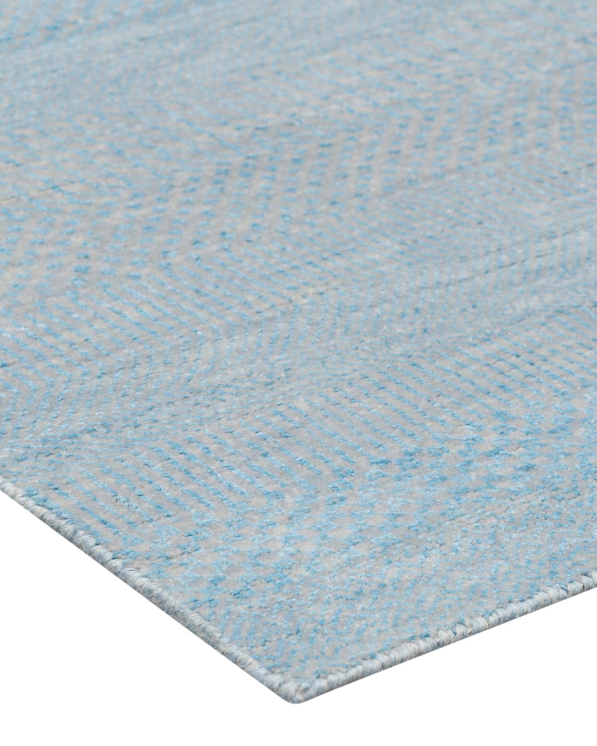 Color: Sky. Made in: India. Subtle tone-on-tone stripes give the solid collection a depth and sophistication all its own. These rugs can pull the disparate elements of a room into a beautifully cohesive whole; they can also introduce an unexpected