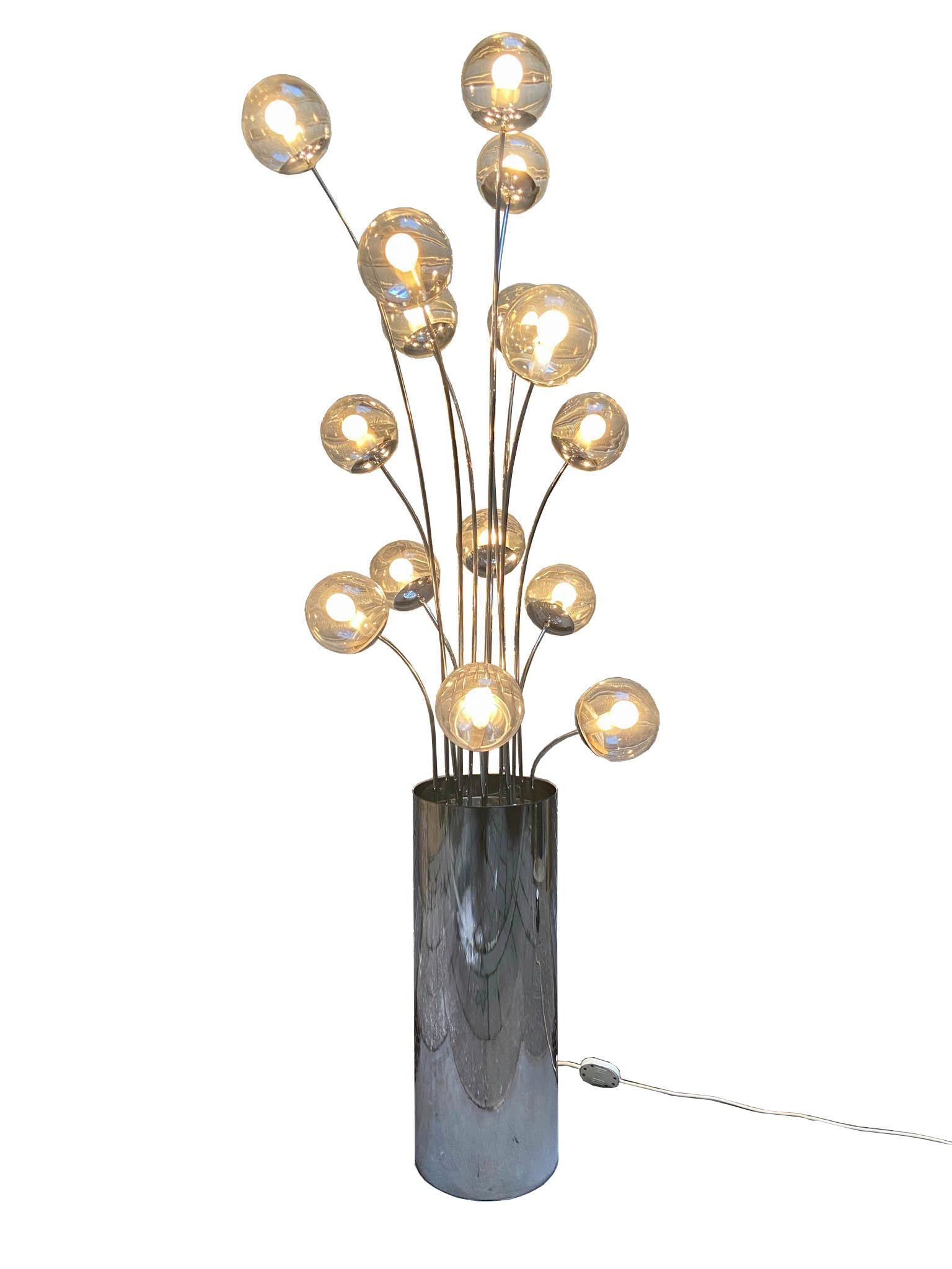 Floor lamp with base in mirror polished stainless steel and stems in polished chromed brass. Sphere diffusers in transparent glass.