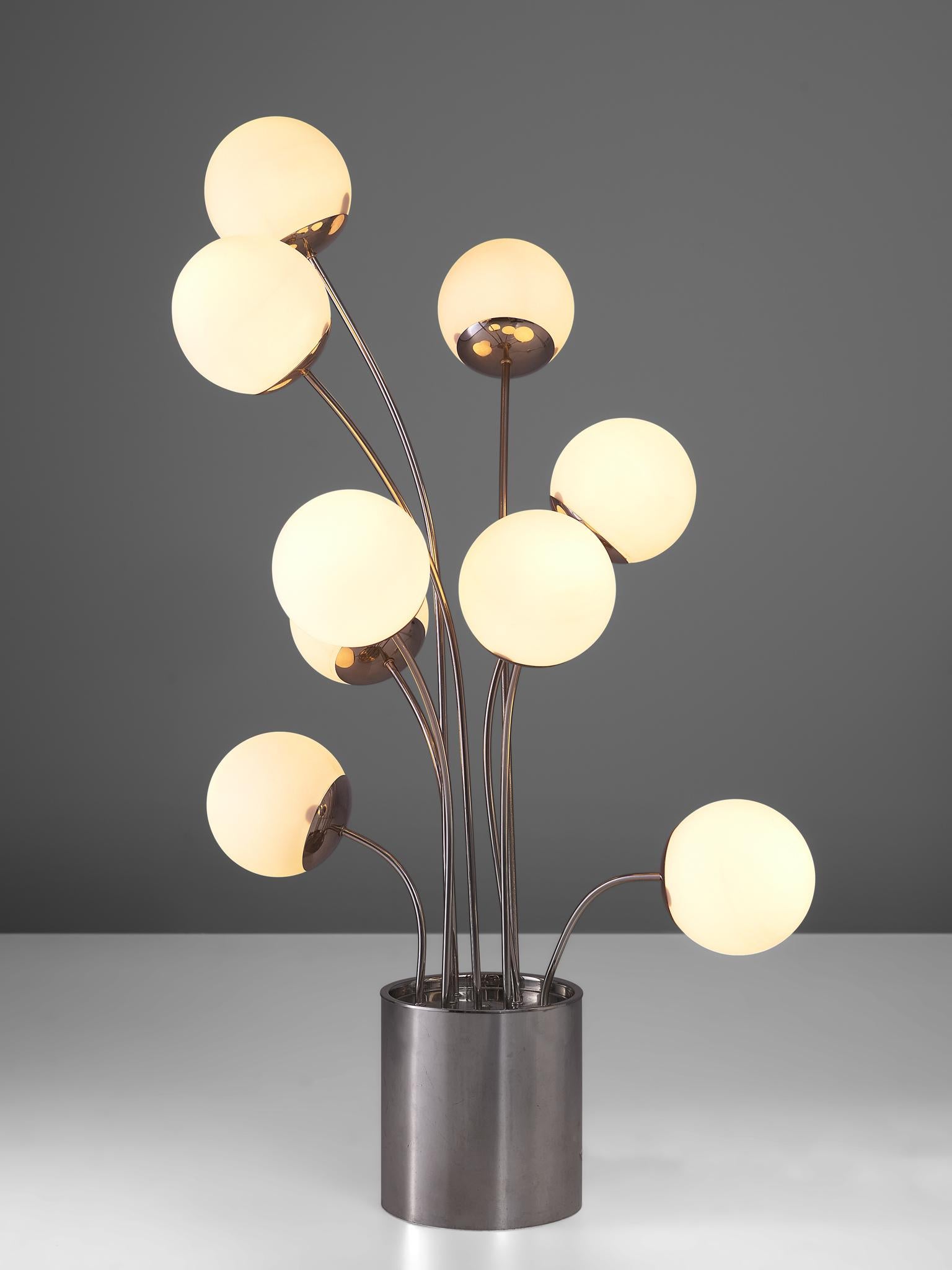 Pia Guidetti Crippa for Lumi, table lamp, chrome and opaline glass, Italy, 1970s.

A dynamic table lamp that features nine stems emanating from the chrome base. Each stem holds an opaline glass globe shade. The have a frivolous appearance and