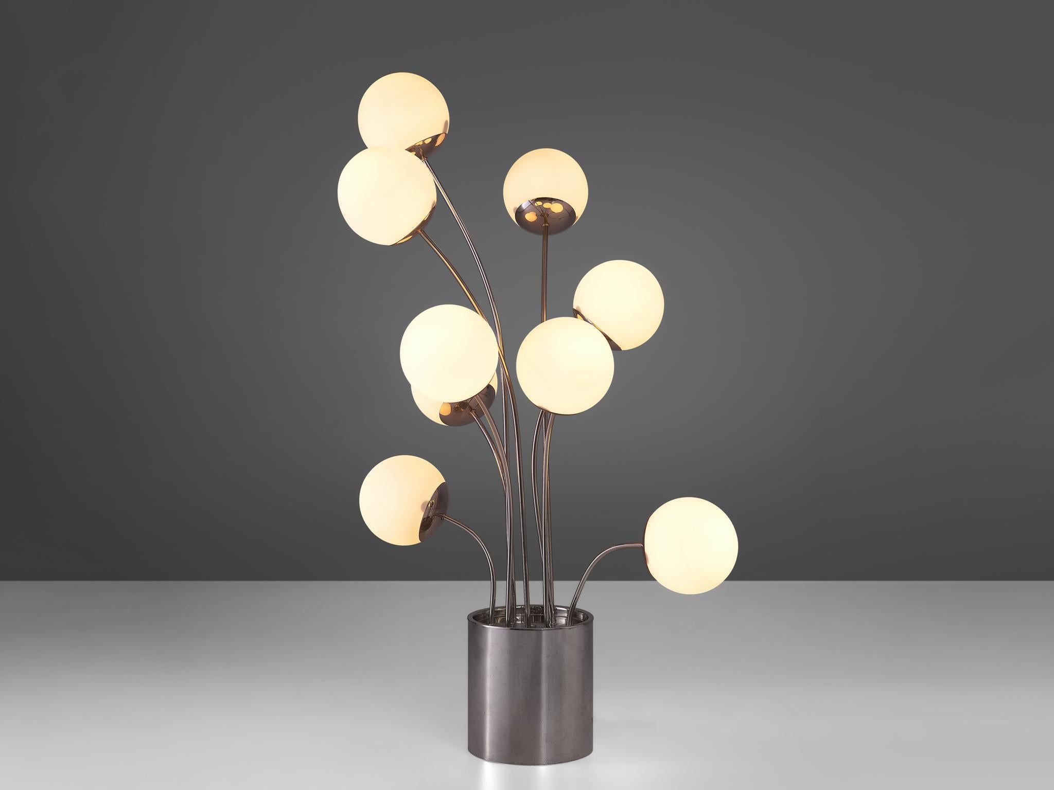 Pia Guidetti Crippa for Lumi, table lamp, chrome and opaline glass, Italy, 1970s.

A dynamic table lamp that features nine stems emanating from the chrome base. Each stem holds an opaline glass globe shade. The have a frivolous appearance and