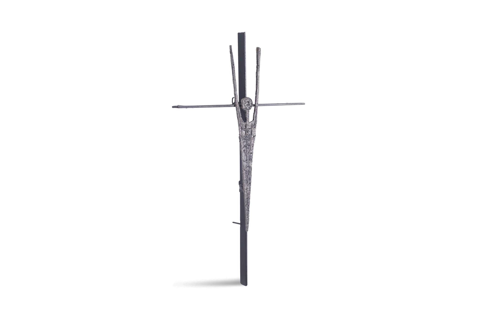 Brutalist 1960s belgian sculpture which might depict a modern version of Jesus on the cross with his hands raised.
Cast iron on black steel.
     