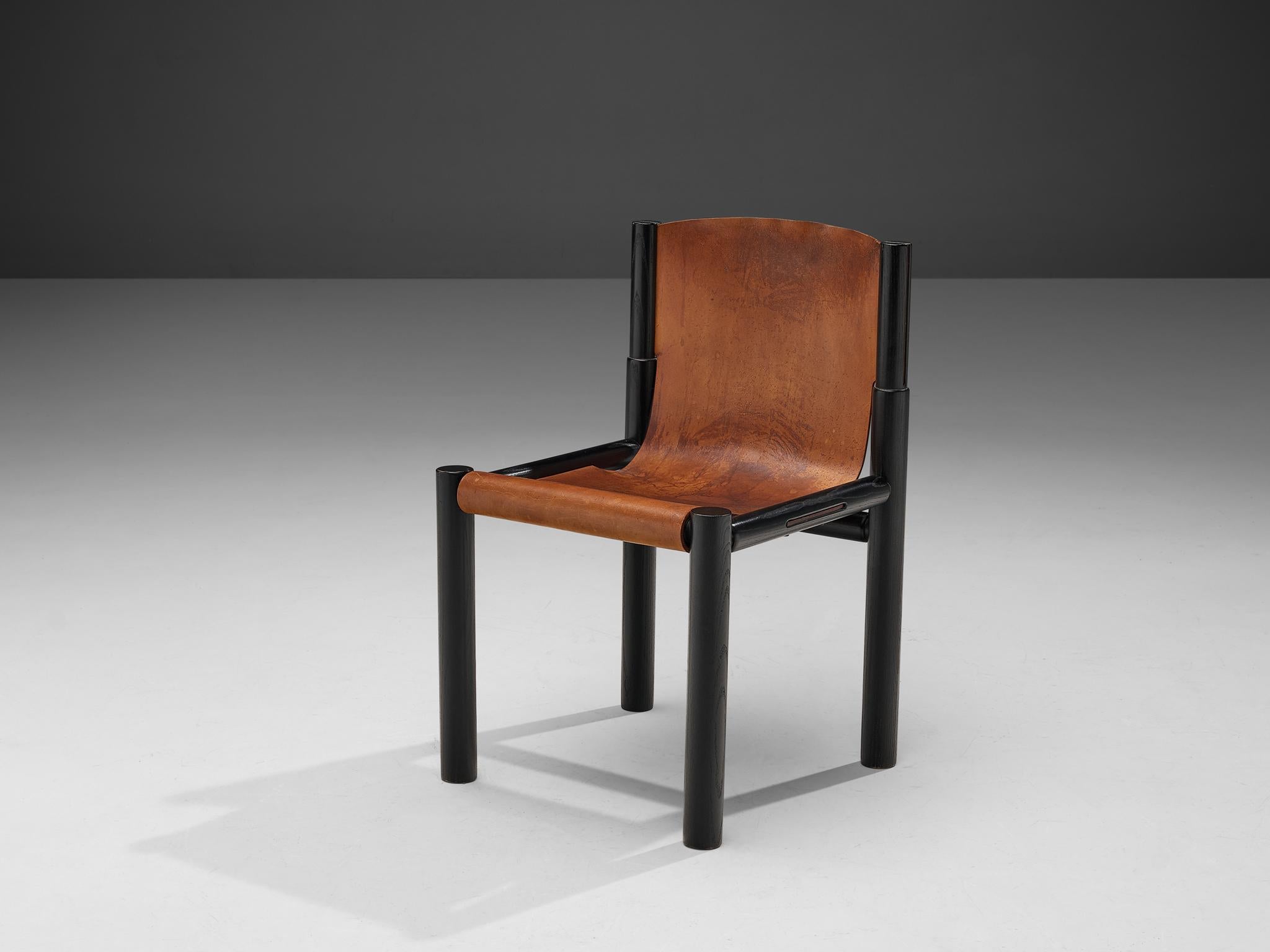 Pia Manu, chair, cognac leather, ebonized wood, Belgium, 1970s 

This wonderful chair features a geometric, sturdy black painted wooden frame. The frame shows great, subtle details. The seat is executed with fine cognac leather that has patinated