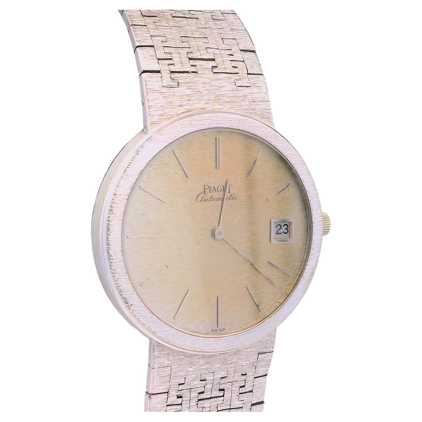 This elegant timepiece by Piaget, crafted in 1980, showcases a refined round design. The watch features a 34mm face, meticulously crafted from 18k white gold, exuding a subtle yet sophisticated allure. 

The dial is adorned with a minimalist