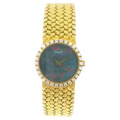 Piaget 15706 D2 Ladies Watch – 18K Yellow Gold, Diamond Bezel, Opal Dial, Quartz