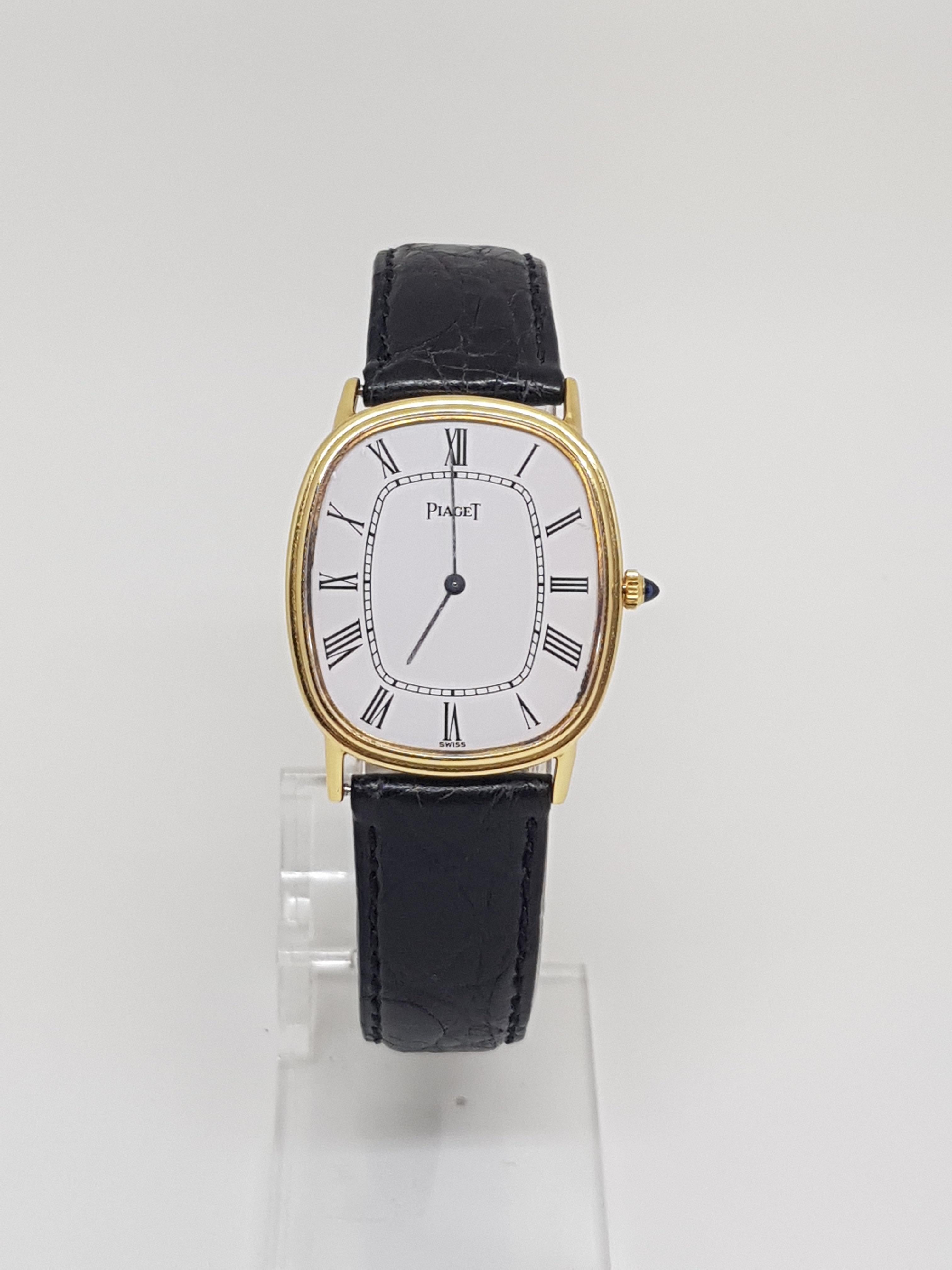 Piaget (stamped) ref.: 94438 / 386668 
Mechanical 
Case: 18 kt yellow gold 
Total weight: 31.42 g 
Diameter: 27 mm 
Bracelet length: adjustable up to 7.4 inches
Age: ca. 1990 
In perfect condition 
Sapphire on the crown 
Documentation and box not