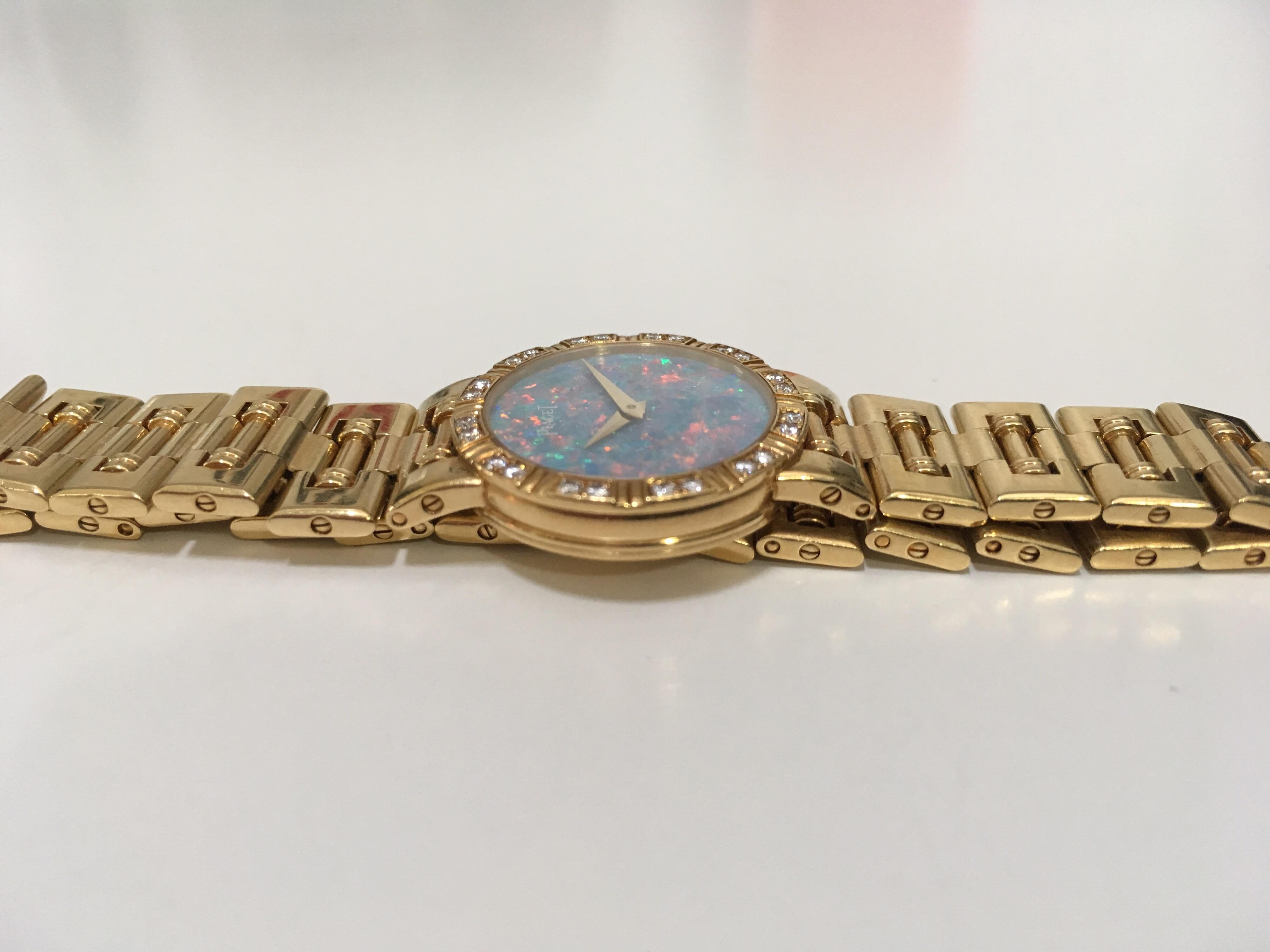 A ladies 18k Piaget Dancer watch with an 18K link bracelet and Opal face. The bezel measures 23mm and has been set with 24 rbc diamonds, measuring approximately 1mm each. This stunning understated watch, definitely makes a statement! The back is