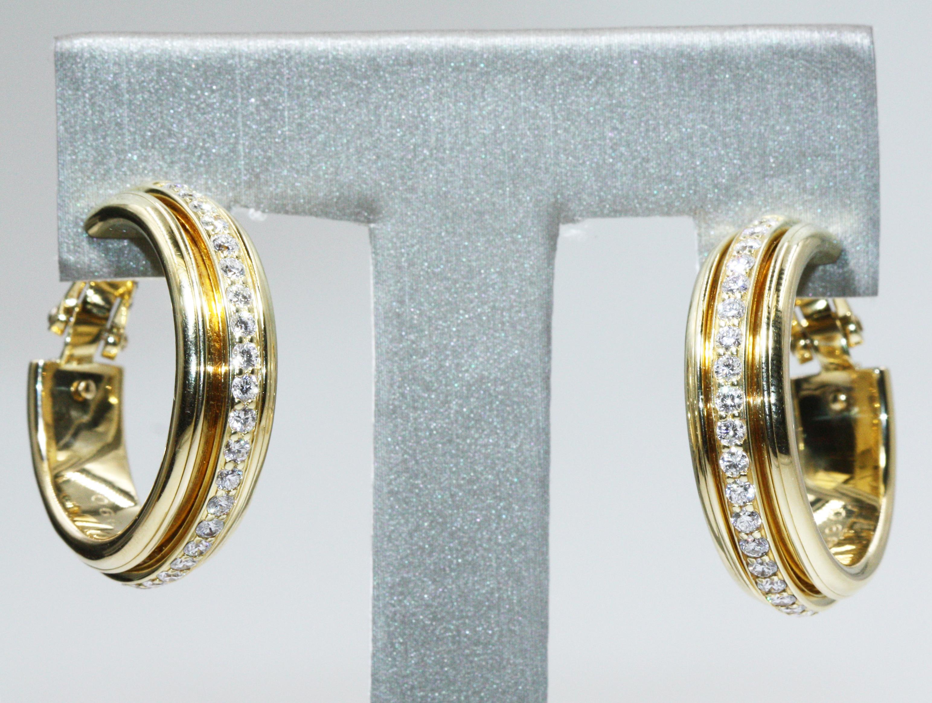 A pair of 18k yellow gold hoop earrings from the Possession collection by Piaget. Set with diamonds. he hoops have fluted boarders with a freely moving ring in the centre.
Weight: approximately 13.7g
Earring diameter: approximately 1.4cm
RE:
