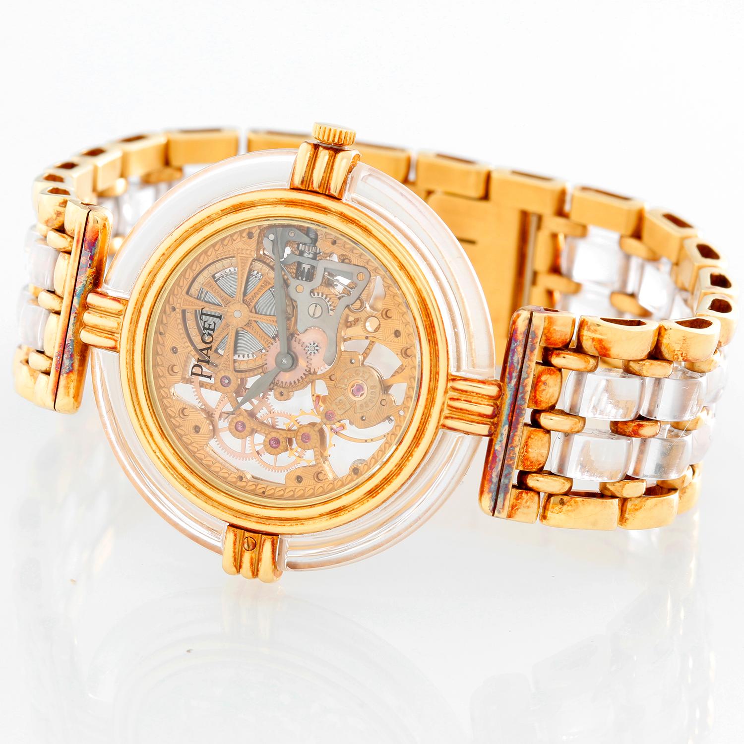 Piaget 18K  Yellow Gold Skeleton  Watch - Manual. 18K Yellow gold and rock crystal ( 32 mm ). Skeleton dial with smooth rock crystal bezel. 18K Yellow gold and rock crystal Piaget integral link bracelet and 18K yellow gold clasp. Pre-owned with