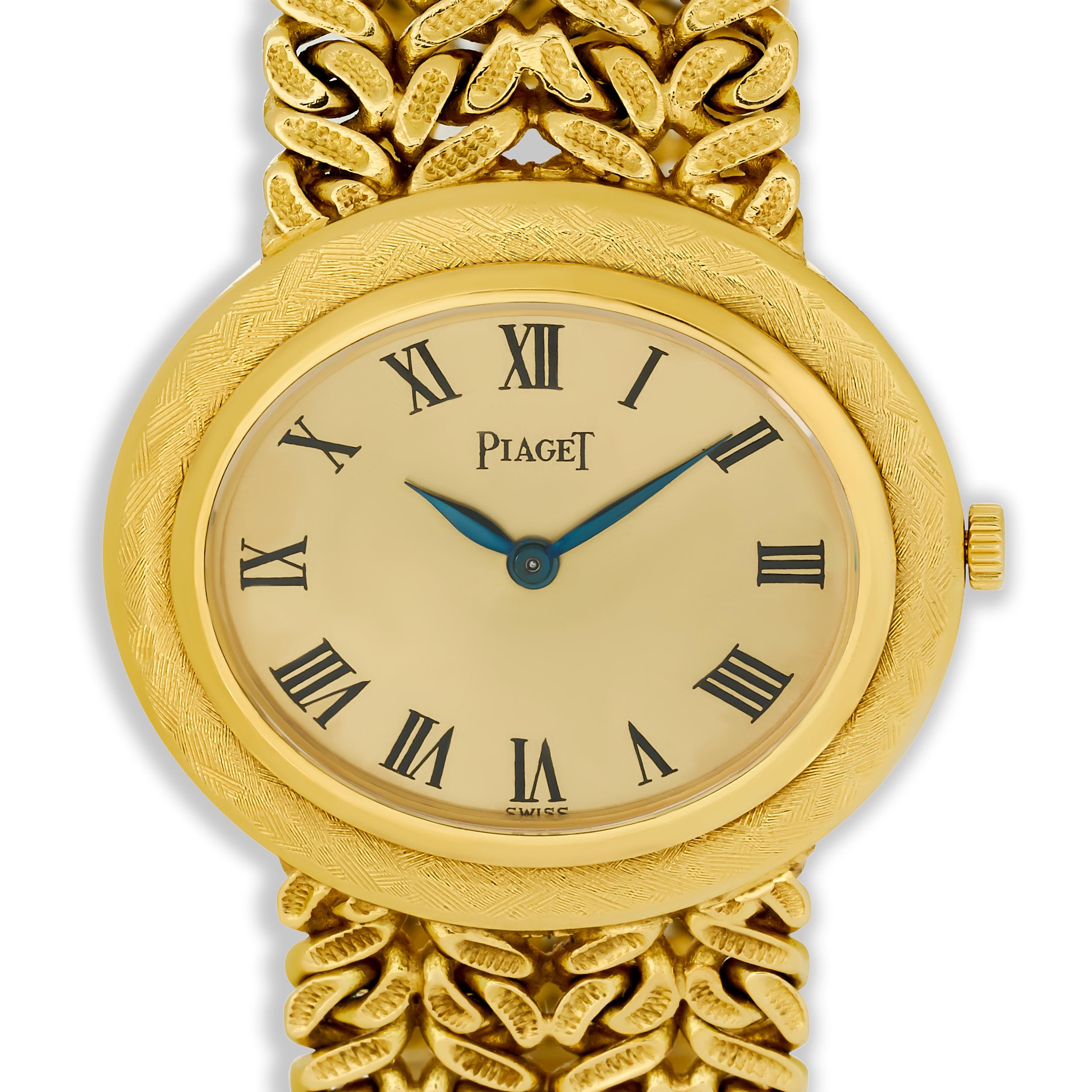 This elegant Piaget watch features a classic oval case and a woven 18 karat yellow gold bracelet, showcasing a timeless design with a minimalist dial and Roman numeral markers.

Watch length 6.50