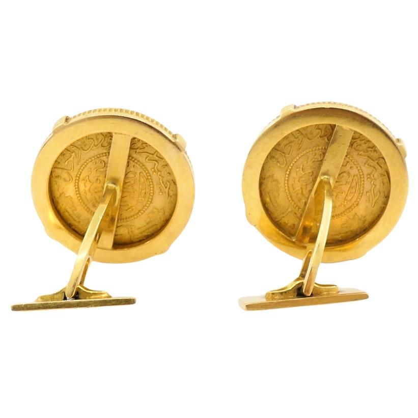 These vintage Piaget men cufflinks use One Gunayh 22k gold coins as their central feature, in an 18k gold setting. The coins show detailed Arabic script and motifs. The fine milgrain edge on the coins adds a detail that complements the structured