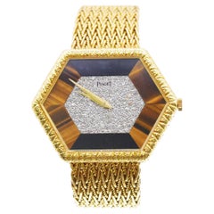 Piaget 18k Hexagon Wrist Watch with Diamond and Tiger eye accents.