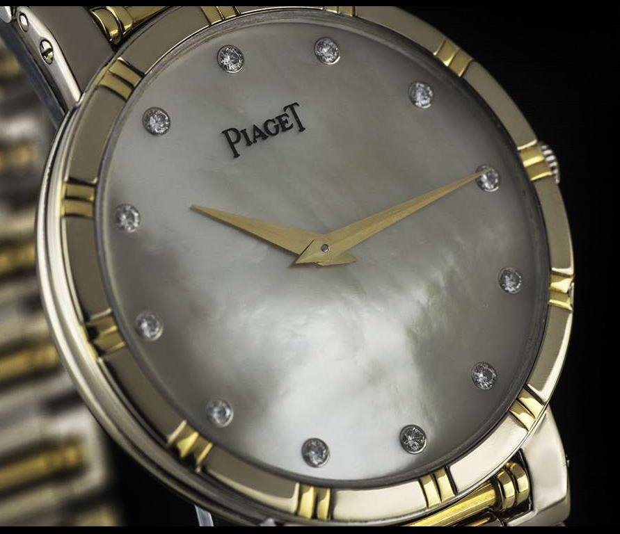 A 31 mm 18k White Gold & 18k Yellow Gold Dancer Gents Wristwatch, white mother of pearl dial with 12 applied round brilliant cut diamond hour markers, a fixed 18k white gold and 18k yellow gold bezel, an 18k white gold and 18k yellow gold bracelet