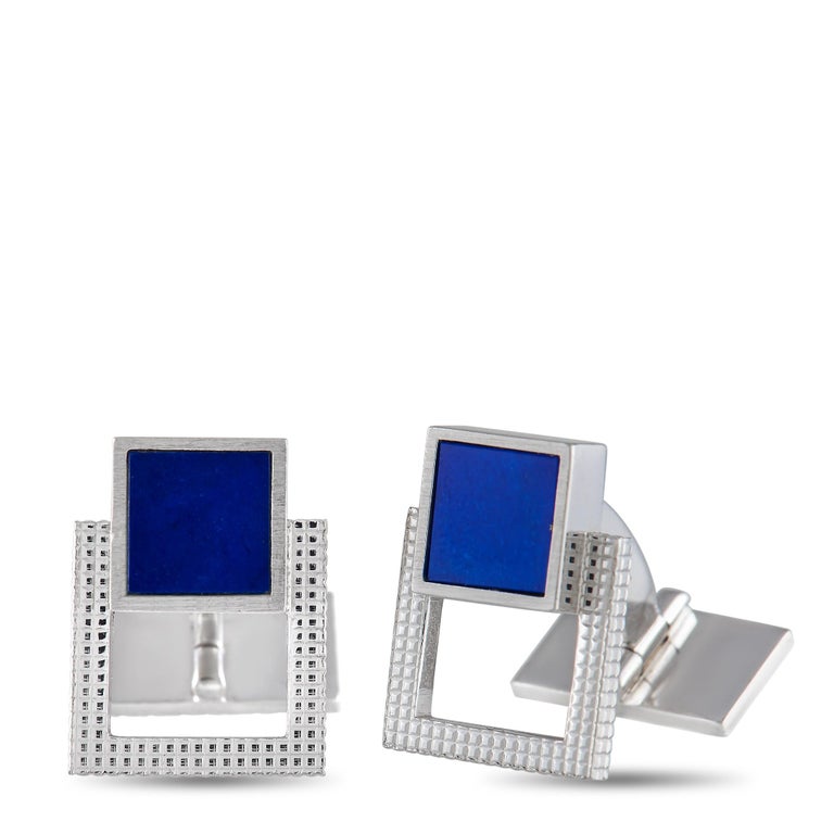 Elevate any suited look with these sleek Piaget cufflinks. Clean and contemporary, each one is crafted from 18K White Gold and measures 0.75” long by 0.5” wide. Their striking, geometric design makes even more of a statement thanks to a bold blue