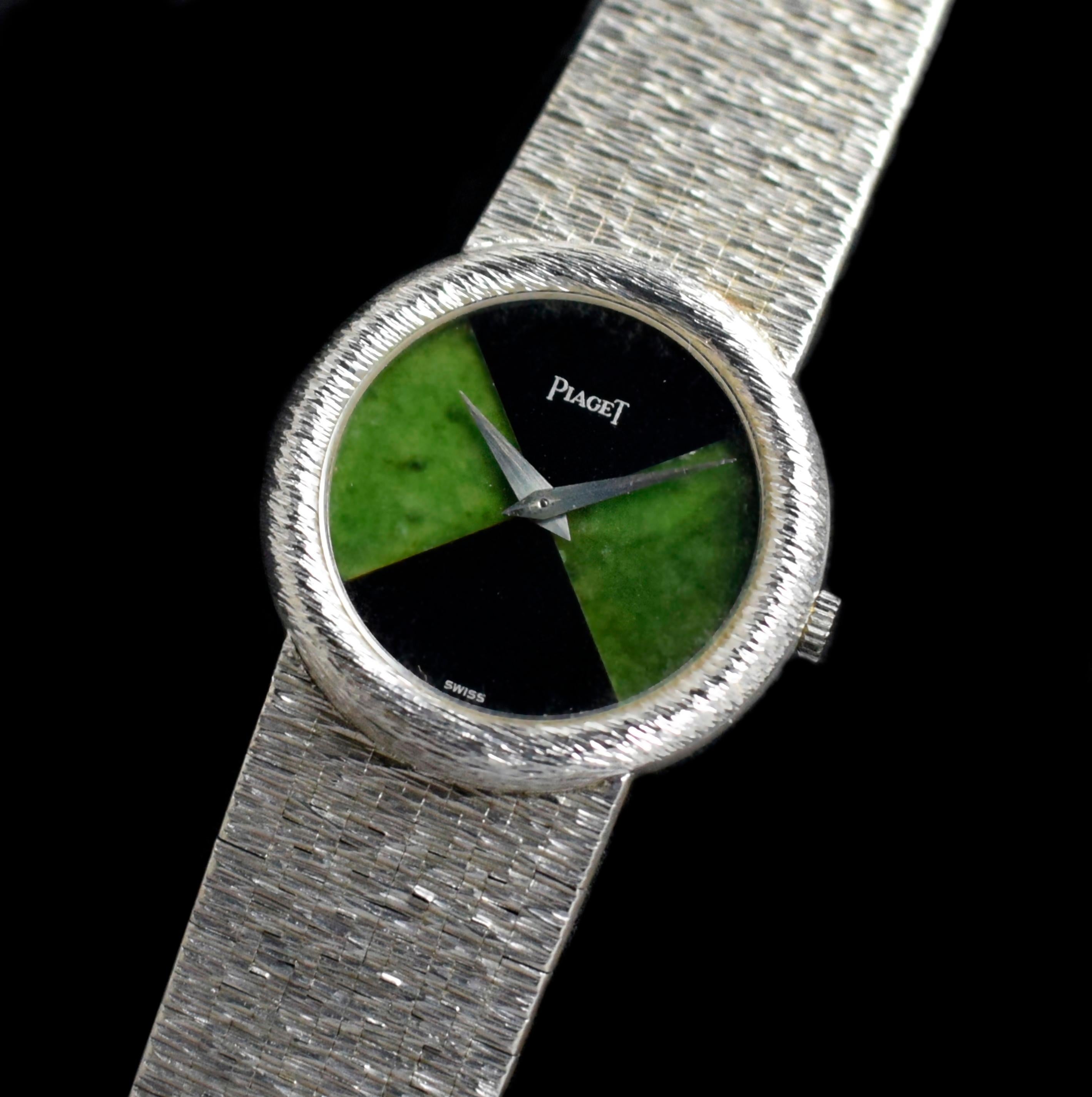 Brand: Piaget
Model: 9040A6 
Year: 1980-1990’s
Serial number: 25xxxx
Reference: C04277

This stunning 1980s Piaget Ref.9040A6 timepiece is a true work of art.  The round bark finish white gold case with integrated bracelet housing a mesmerizing dial