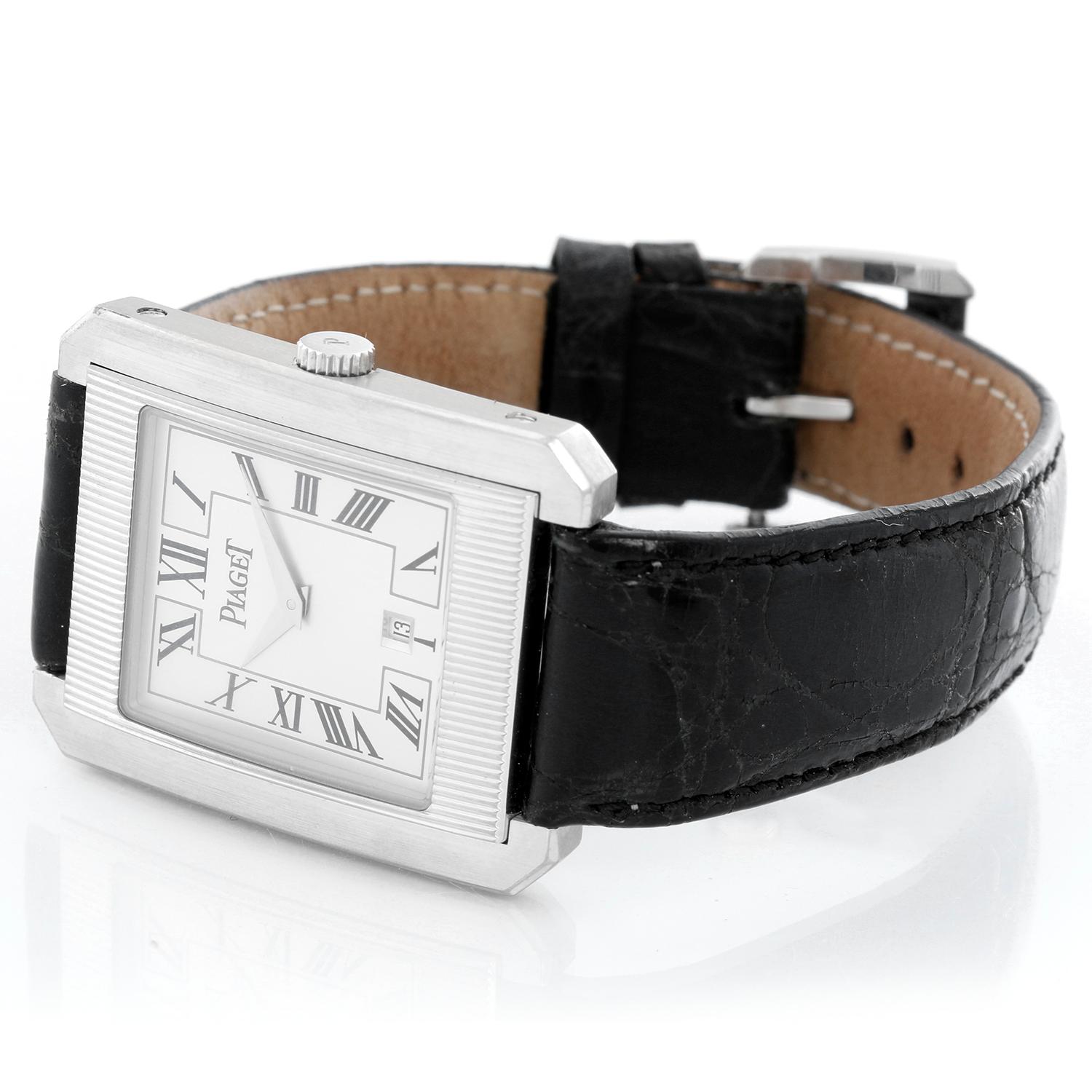Piaget  18K White Gold Protocole Men's Watch Ref. 26200 - Quartz. 18K White gold case ( 31 x 40 mm); sticker on caseback intact. Silver dial with black Roman numerals; date at 6 o'clock. Black alligator strap with 18K white gold Piaget buckle.
