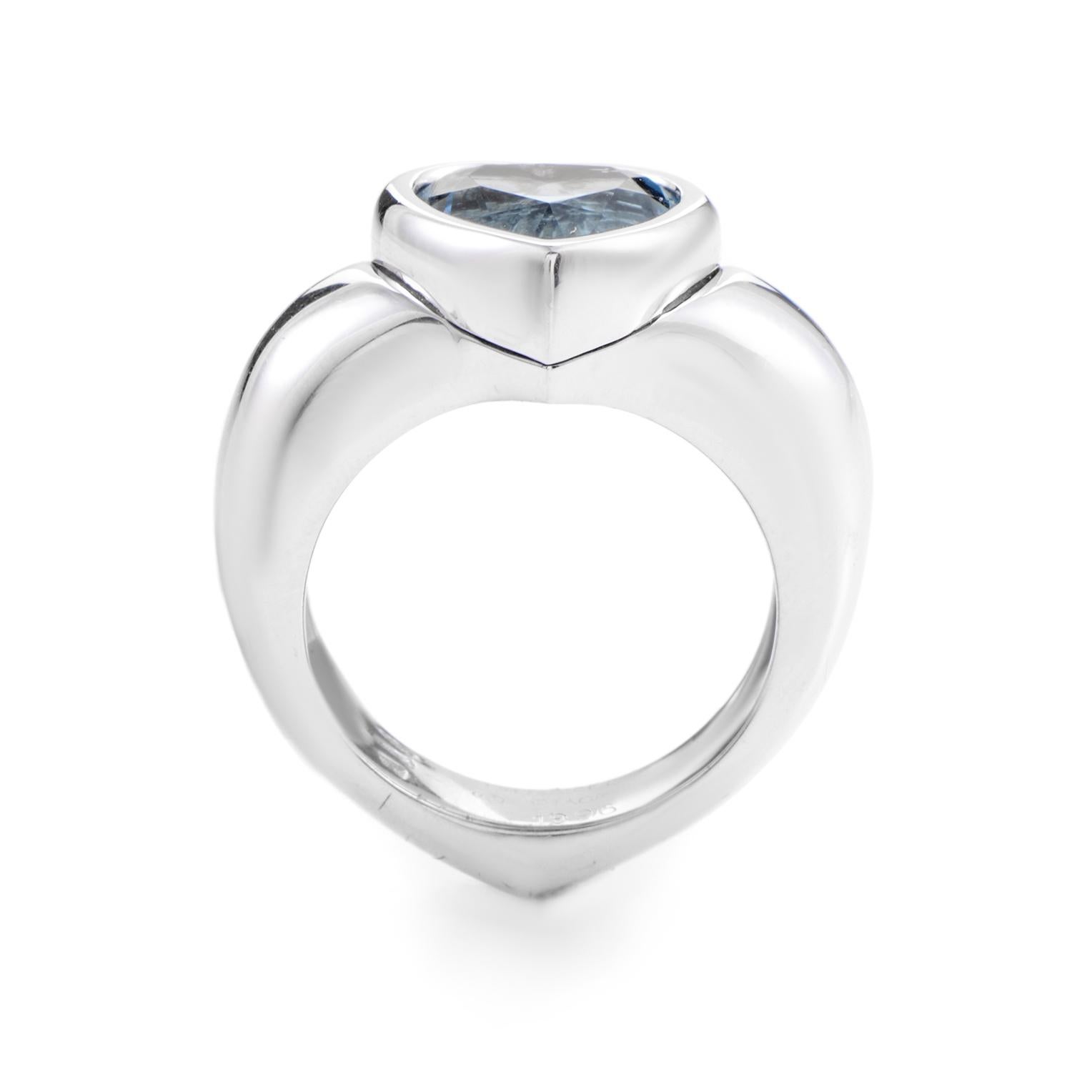 A tantalizing combination of colors makes this gemstone ring from Piaget a real standout! The ring is made of 18K white gold and features a topaz stone set in a heart-shaped bezel.
