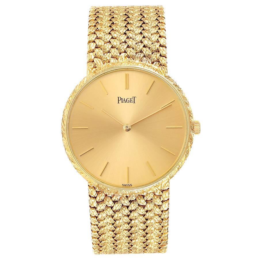 Piaget 18k Yellow Gold Champagne Dial Vintage Mens Watch 9065. Manual winding movement. 18k yellow gold slim case 31.0 mm in diameter. . Mineral glass crystal. Champagne dial with raised gold baton hands and hour markers. 18K yellow gold basket