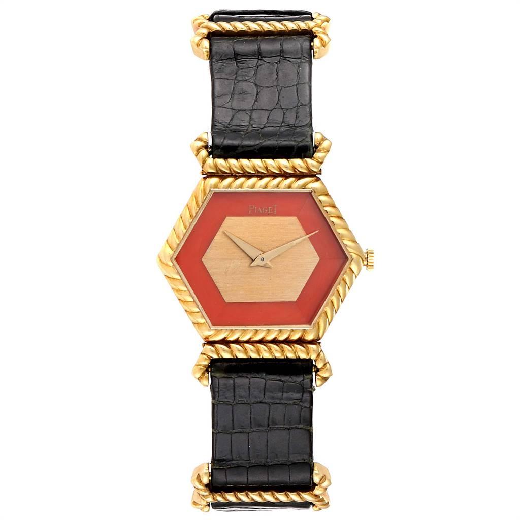 Piaget 18K Yellow Gold Coral Dial Hexagonal Vintage Ladies Watch 9559. Manual winding movement adjusted to 5 positions and temperatures. 18k yellow gold hexagonal case 29.0 x 23.0 mm. 18k yellow gold rope pattern engraved octagonal bezel. Mineral