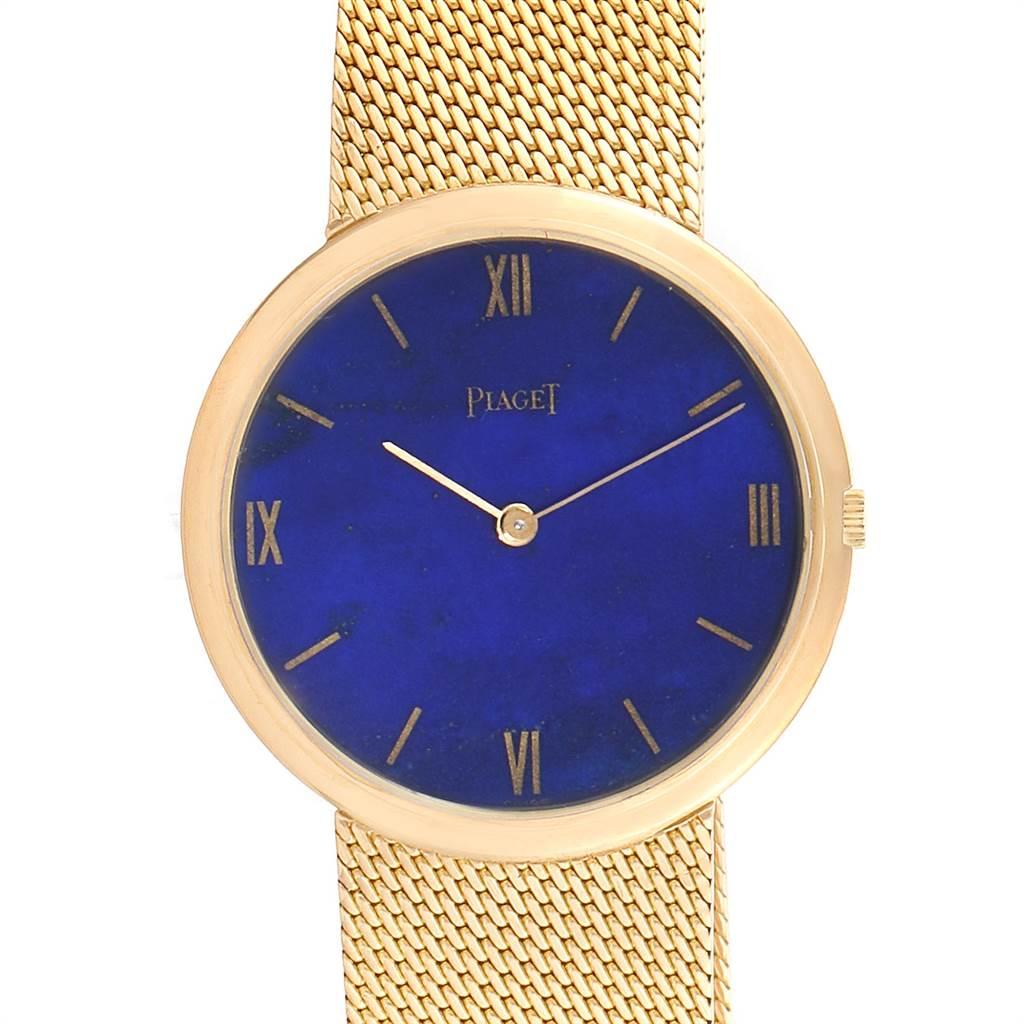 Piaget 18k Yellow Gold Lapis Lazuli Dial Vintage Mens Watch 902B11. Manual winding movement. 18k yellow gold slim case 31.0 mm in diameter. Mineral glass crystal. Lapis Lazuli dial with baton hour markers and roman numerals. 18k yellow gold