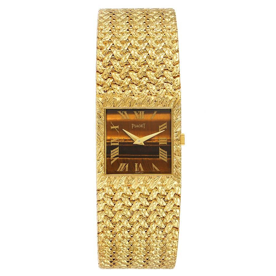 Piaget 18k Yellow Gold Tiger Eye Stone Dial Vintage Mens Watch 9352. Manual winding movement. 18k yellow gold case 23.0 x 23.0 mm. . Scratch resistant sapphire crystal. Tiger eye dial with 18K yellow gold Dauphine hands. Printed gold roman numeral