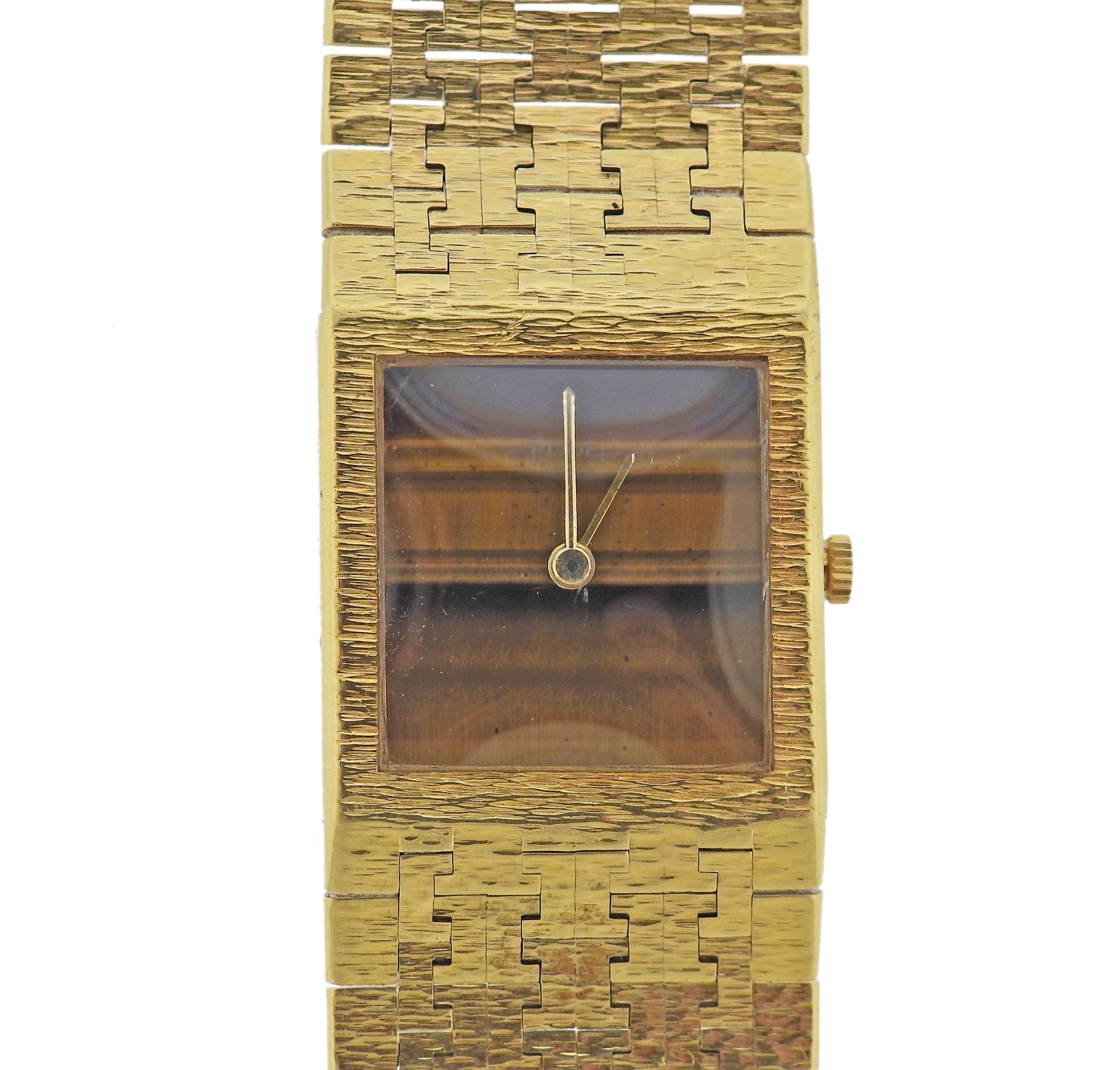 Vintage circa 1970s, Piaget watch, in 18k gold, with tiger's eye dial. Quartz movement. Case - 23mm x 25mm. Bracelet is 7 1/8