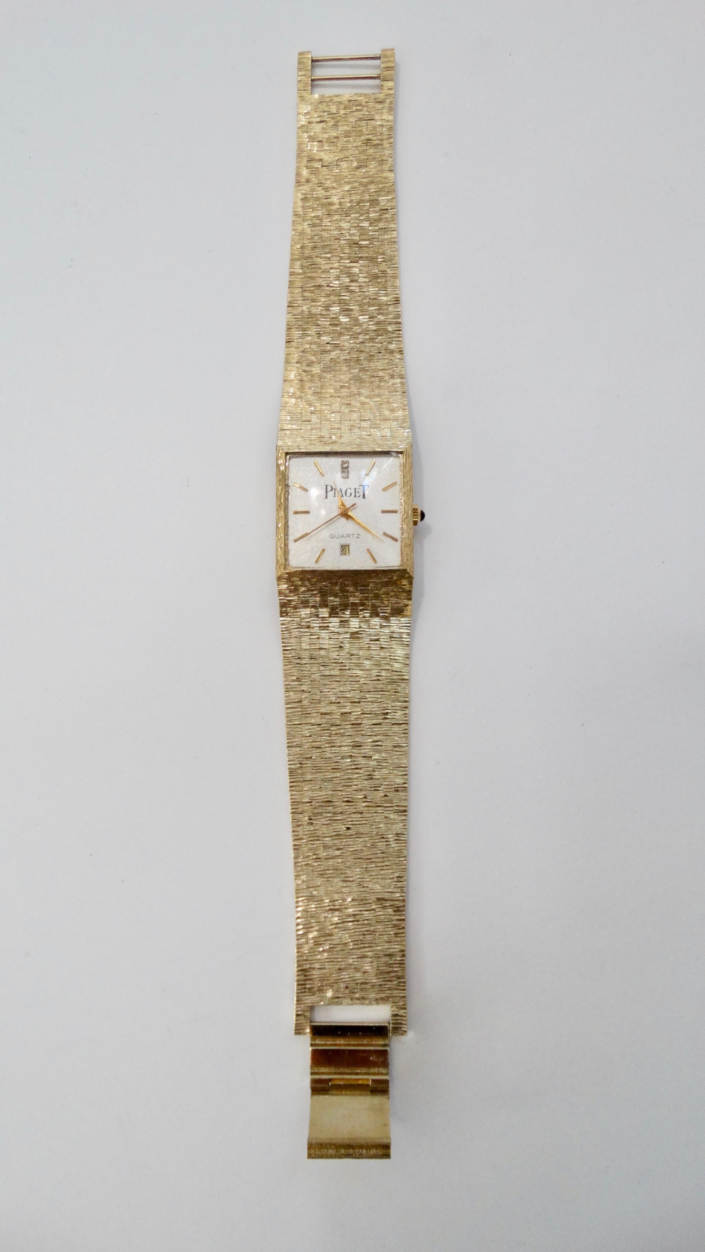 Gorgeous 1980s Swiss made Piaget watch electroplated in 18k Yellow Gold. Features a sophisticated and flexible bracelet, quartz movement, a white face with gold dials and an Onyx dial turn. A classic time piece! Watch a fits a 5