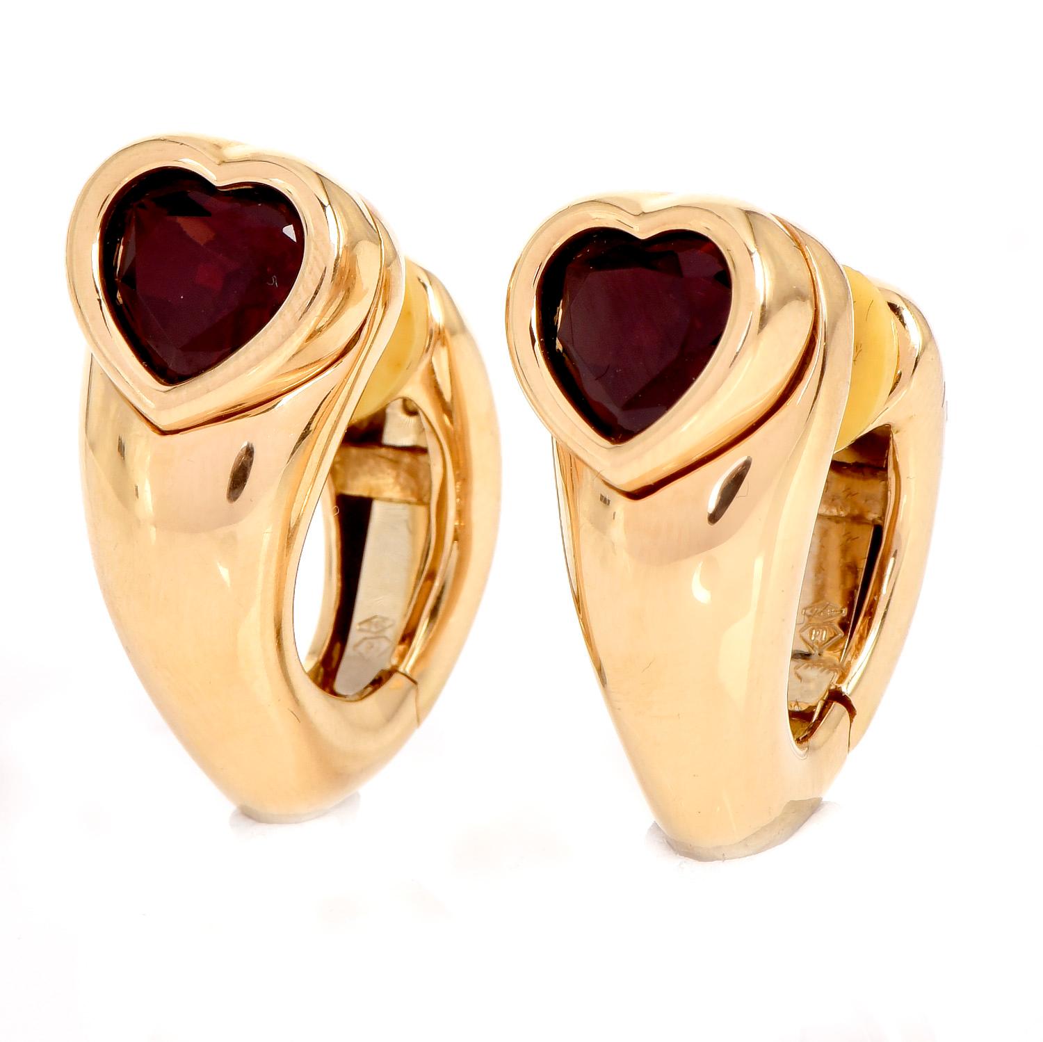 A contrast between High Polished Gold & Deep Color Red, are these exquisite Piaget earrings.

These collectible vintage Piaget Crafted in Luxurious 18K yellow gold, these earrings

measure approx. 25 mm x 11 mm, 

Romantically presenting (2) Heart