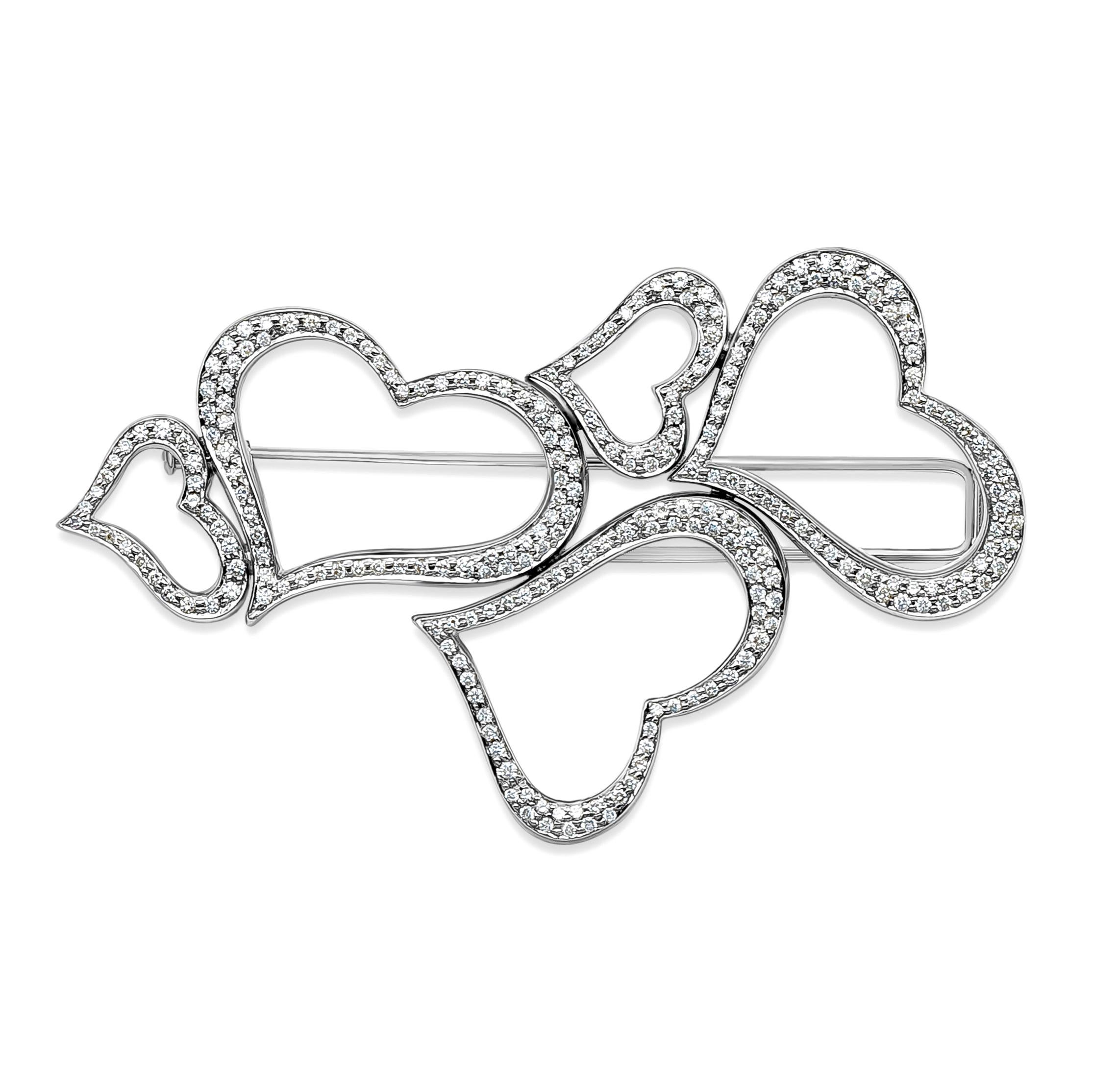 A unique and classic heart brooch, showcasing 2.30 carats total of round brilliant cut diamonds with D-E-F color and VVS clarity. Beautifully set in an open-work heart design. Made with 18K white gold, 3.10 inches in length and 1.80 inches in width.