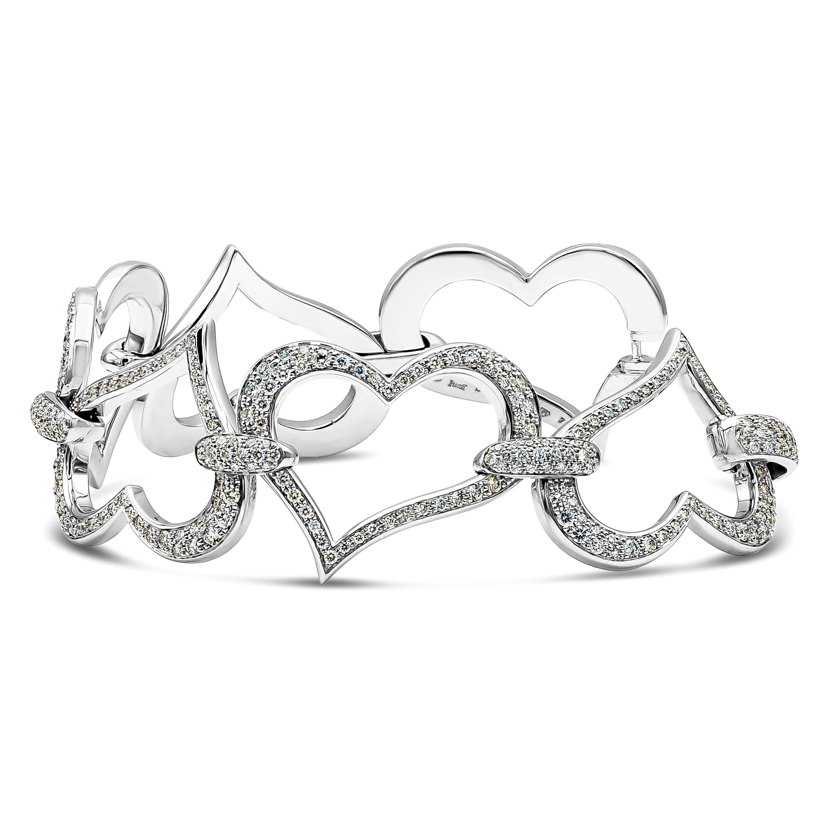 A large vogue-ish heart link bracelet, featuring 4.70 carats of round diamonds with D-E-F color and VVS clarity. The heart links are approximately 1 inch wide and made of 18K white gold. Gorgeously made and signed by Piaget. Available with matching