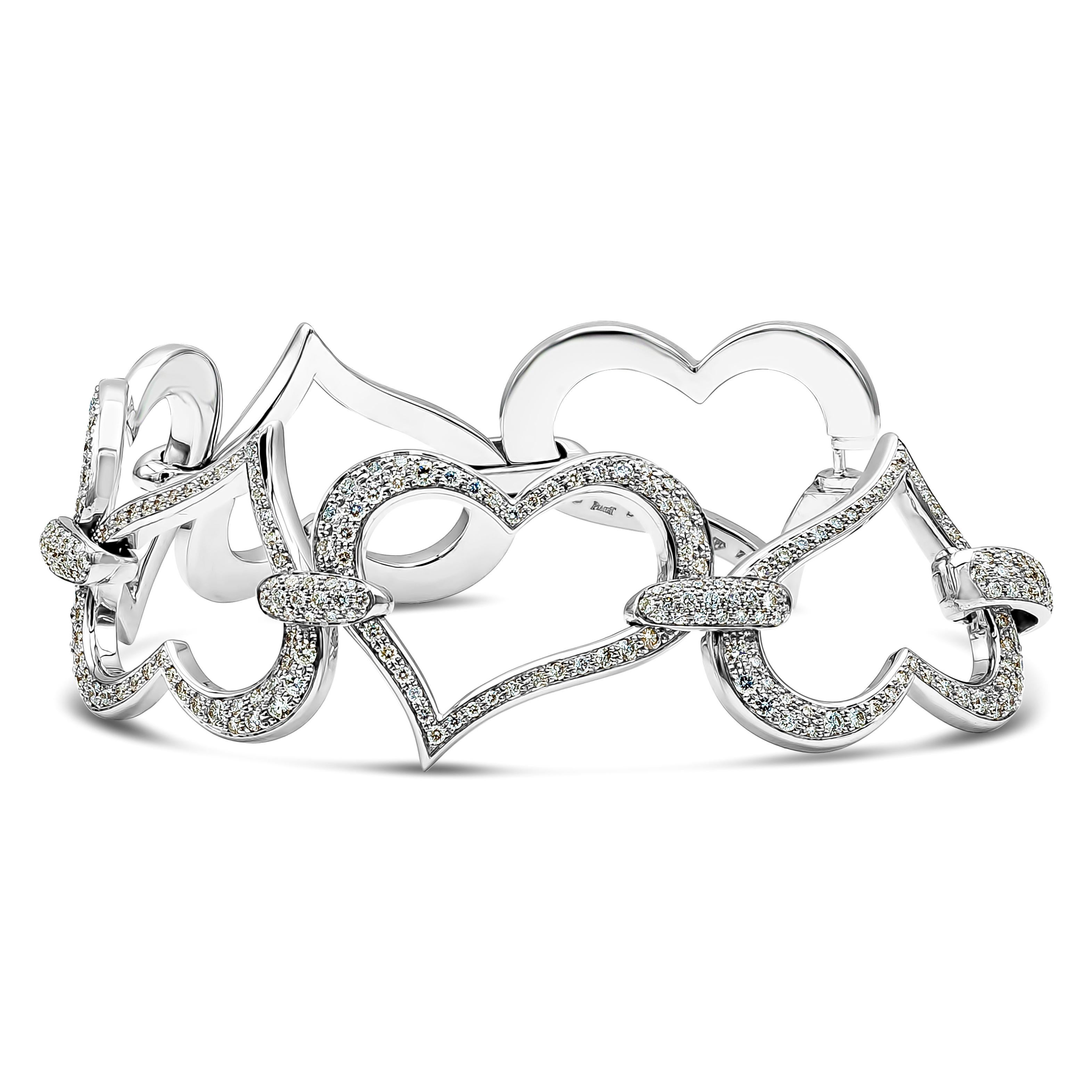 A large vogue-ish heart link bracelet, featuring 4.70 carats of round brilliant cut diamonds with D-E-F color and VVS clarity. The heart links are approximately 1 inch wide and made of 18K white gold. Gorgeously made and signed by