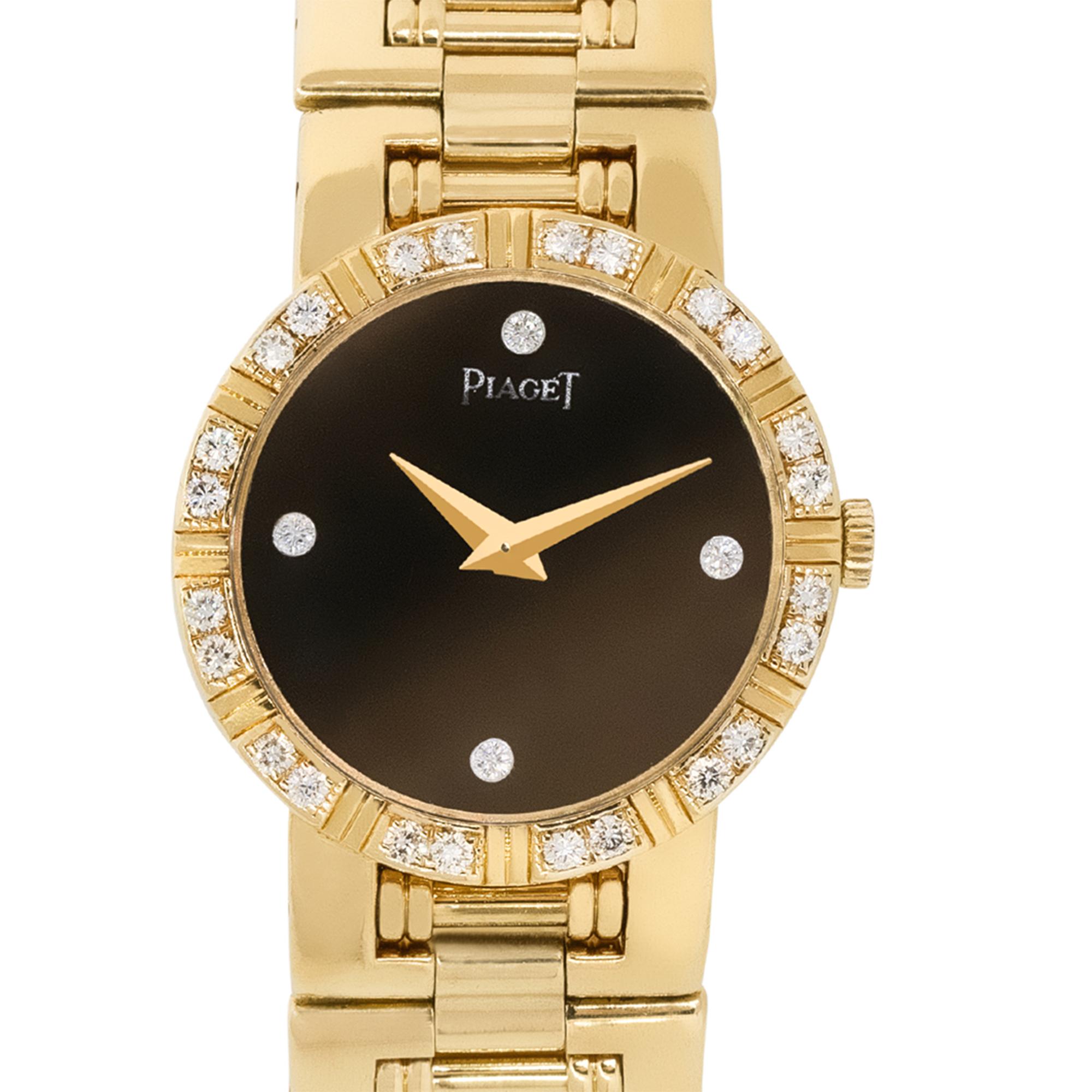 Brand: Piaget
Model: 80564 K 81
Case Material: 18k yellow gold
Case Diameter: 25mm
Crystal: Scratch resistant sapphire
Bezel: 18k yellow gold bezel with Diamonds
Dial: Black dial with gold roman numerals and hands as well as Diamond hour