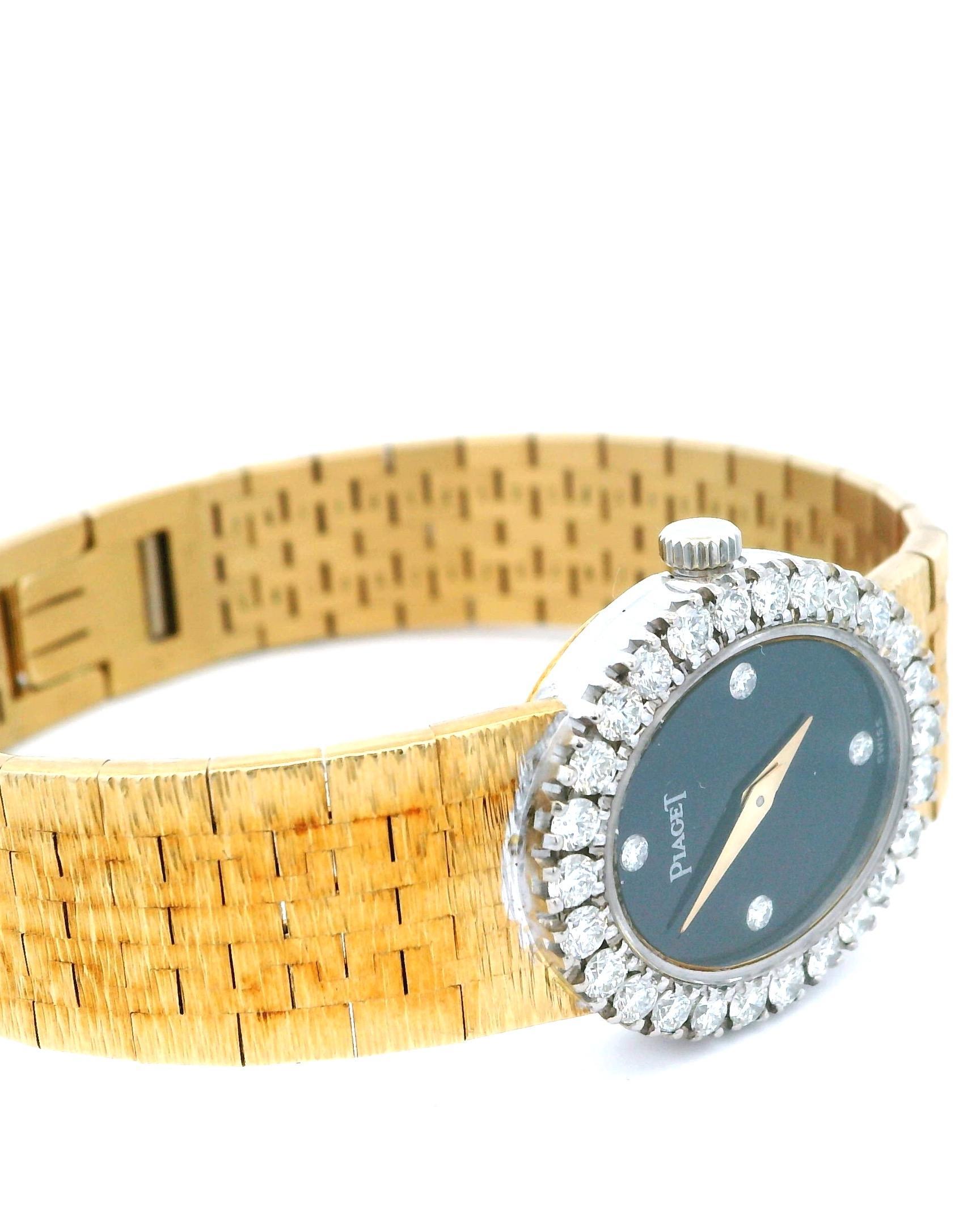 Piaget watch featuring an oval onyx dial set within a surround of round brilliant-cut white diamonds. Crafted in 18k gold. Quartz movement. Made in Switzerland, 1980.
Fits a 5.25-inch wrist.
Length 14.9 cm

Total weight 43.9 g