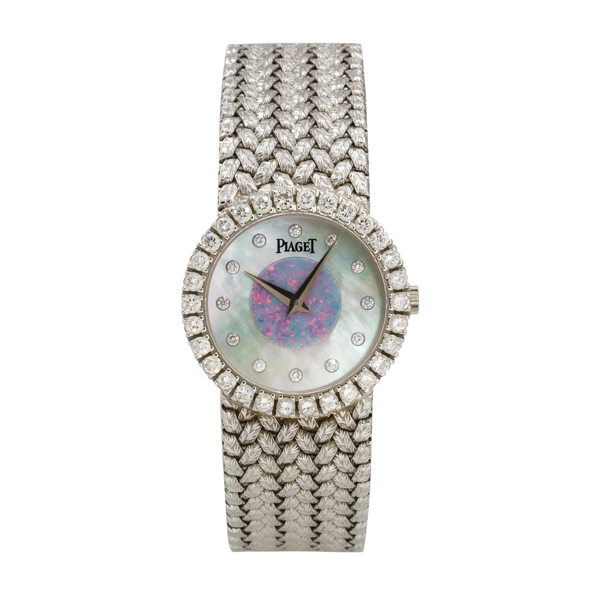 Brand: Piaget
Case Material: 18k White Gold
Case Diameter: 25.5mm
Crystal: Sapphire Crystal
Bezel: 18k White Gold bezel with Diamonds
Dial: Mother of Pearl dial with Opal center, silver hands and Diamond hour markers
Bracelet: 18k White Gold
Size: