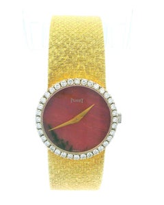 Piaget 9706B68 Rhodochrosite Dial Diamond Bezel Mesh Bracelet in 18K Yellow Gold