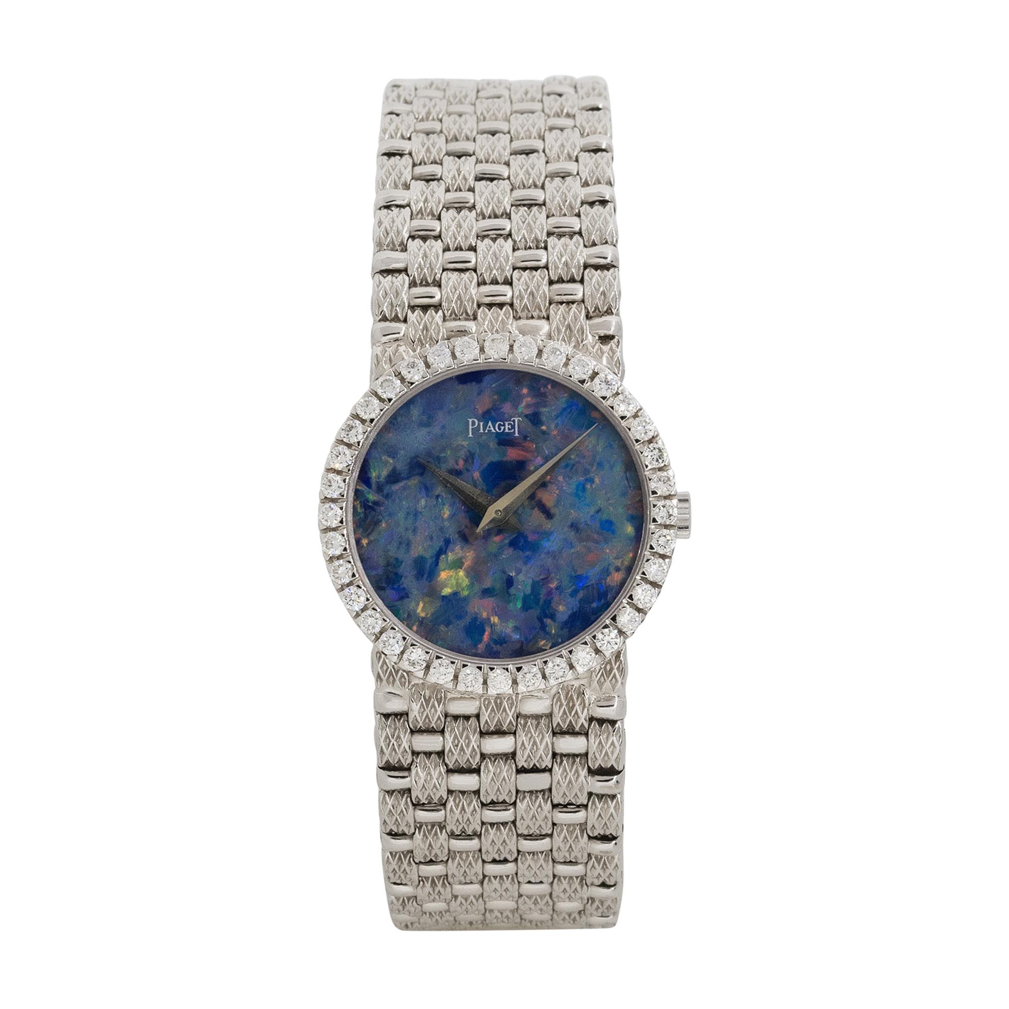Brand: Piaget
Case Material: 18k White Gold
Case Diameter: 24mm
Crystal: Sapphire Crystal
Bezel: 18k white gold Diamond bezel
Dial: Opal dial with silver hands
Bracelet: 18k White Gold bracelet
Size	Will fit a 5.5
