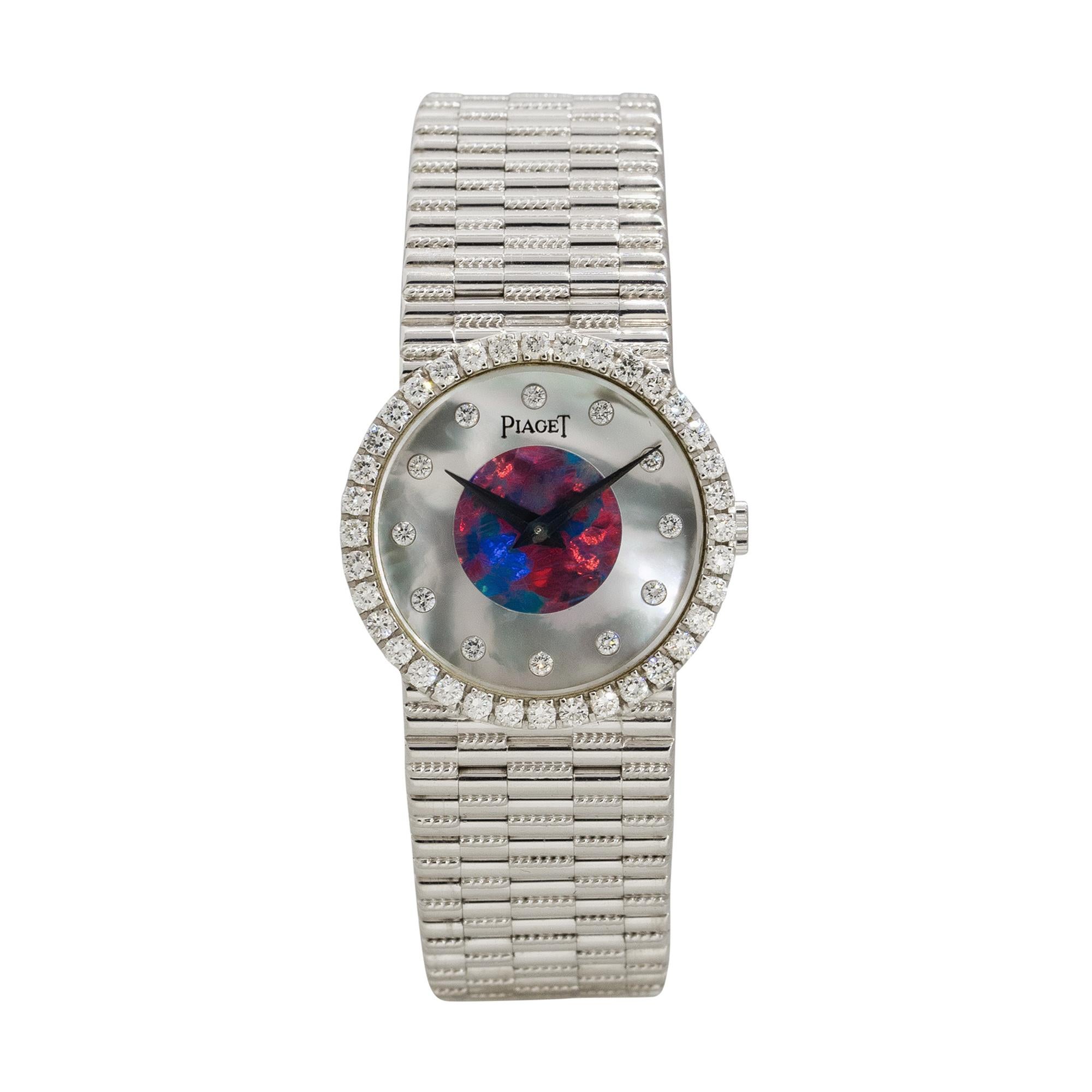 Brand: Piaget
Case Material: 18k White Gold
Case Diameter: 24mm
Crystal: Sapphire Crystal
Bezel: 18k White Gold bezel with Diamonds
Dial: Mother of Pearl, Opal dial with white gold hands and Diamond markers
Bracelet: 18k White Gold
Size: Will fit a