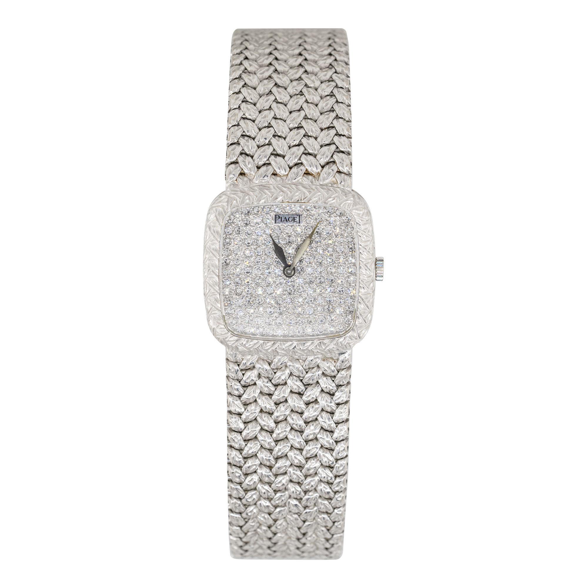 Brand: Piaget
Case Material: 18k White Gold
Case Diameter: 22mm
Crystal: Plastic
Bezel: Textured 18k white gold bezel
Dial: Diamond pave dial with silver hands
Bracelet: 18k White Gold Bracelet
Size: Will fit a 5.5