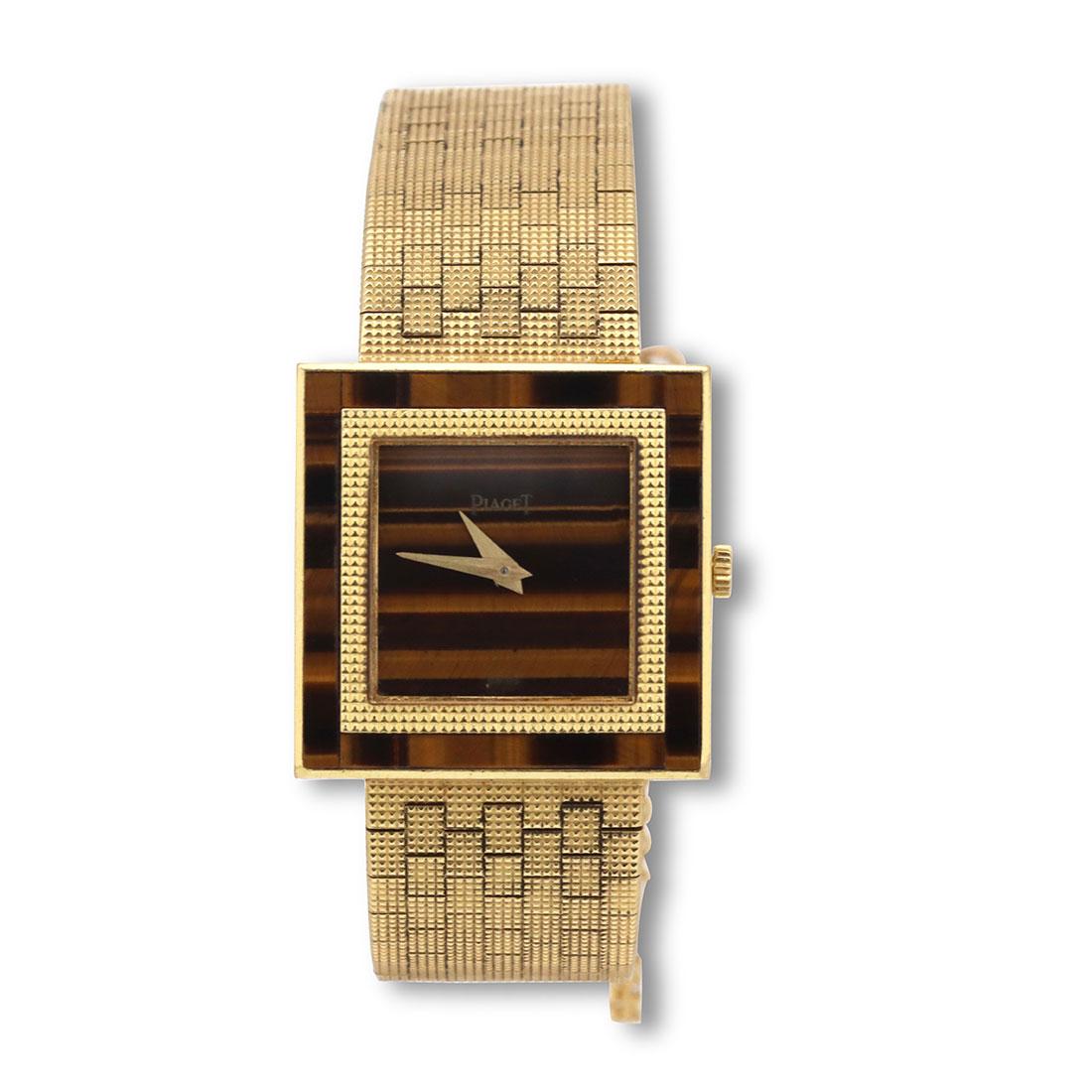 Authentic Piaget Altiplano ladies watch crafted in 18 karat yellow gold. The 18 karat gold square-shaped case measures 25mm x 25mm with a Tiger's eye dial and bezel. Mechanical movement. Will fit up to a 5 3/4 inch wrist.  Watch is not presented