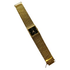 Piaget: 18 Karat Gelbgold Estate-Uhr mit schwarzem Diamant-Zifferblatt und Mesh-Design