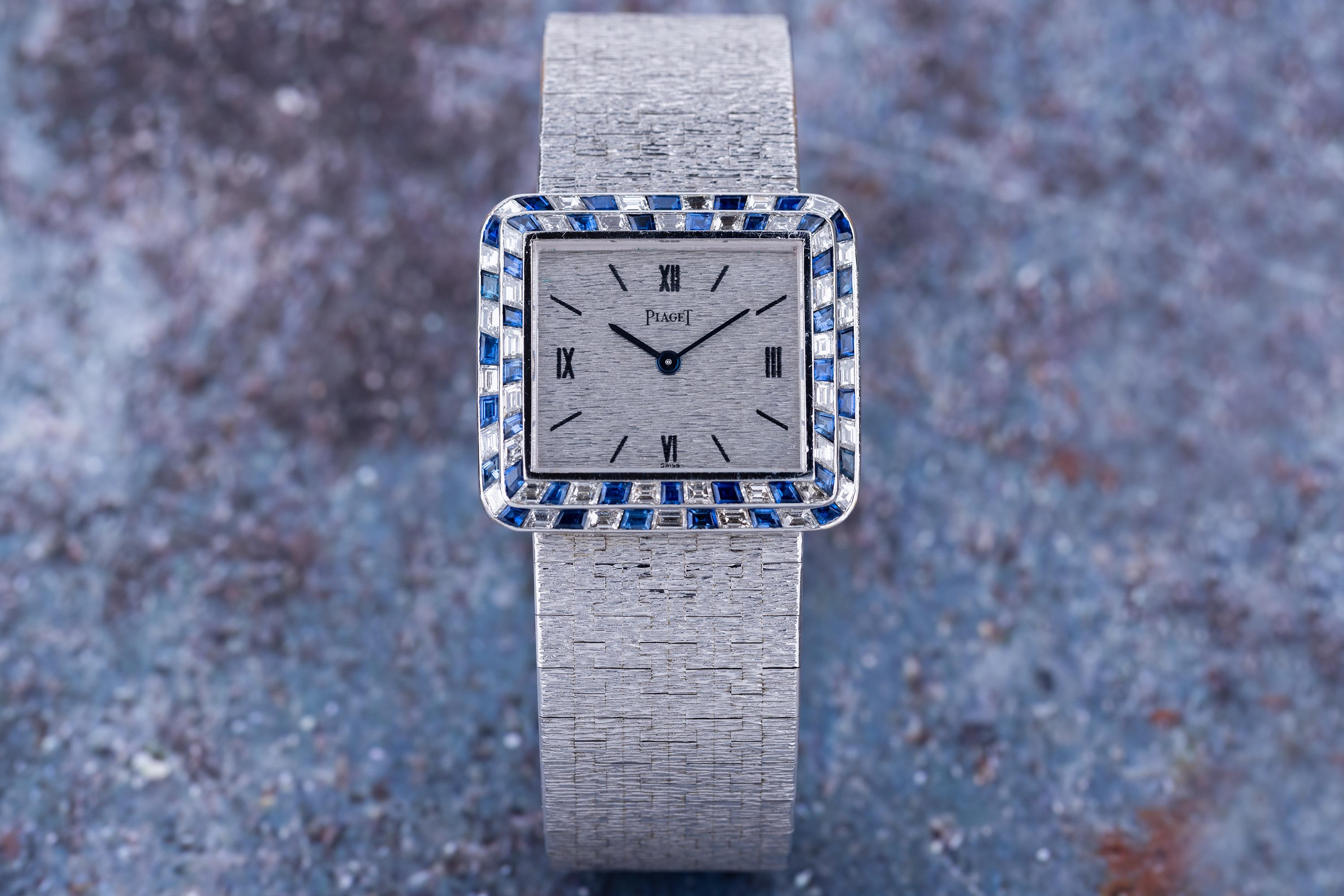 Vintage Piaget  REF. 9366A6  Diamond & Sapphire Bezel  18k White Gold  30mm  1970's

Pre-owned, excellent condition Piaget reference 9366A6 18k white gold gents wristwatch circa 1970's. An 18k White Gold etched dial, Roman numeral and baton hour