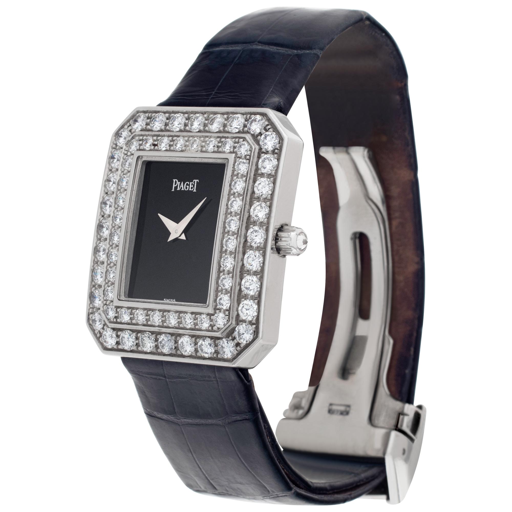 Piaget in 18k white gold with factory original double row of round brilliant cut diamonds. Total approximate diamond weight: 4.80 carats, F-G color, VVS Clarity. Quartz. Case size 27mm x 33mm. Black alligator strap with 18k white gold deployant