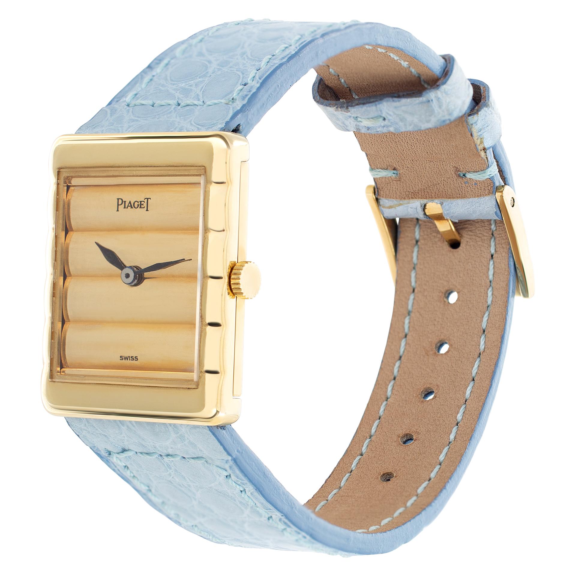 Piaget Classic in 18k on leather strap with an original Piaget 18k tang buckle. Manual. Measures 25mm (lug to lug) by 20mm wide. Ref 40800. Fine Pre-owned Piaget Watch. Certified preowned Dress Piaget Classic 40800 watch is made out of yellow gold