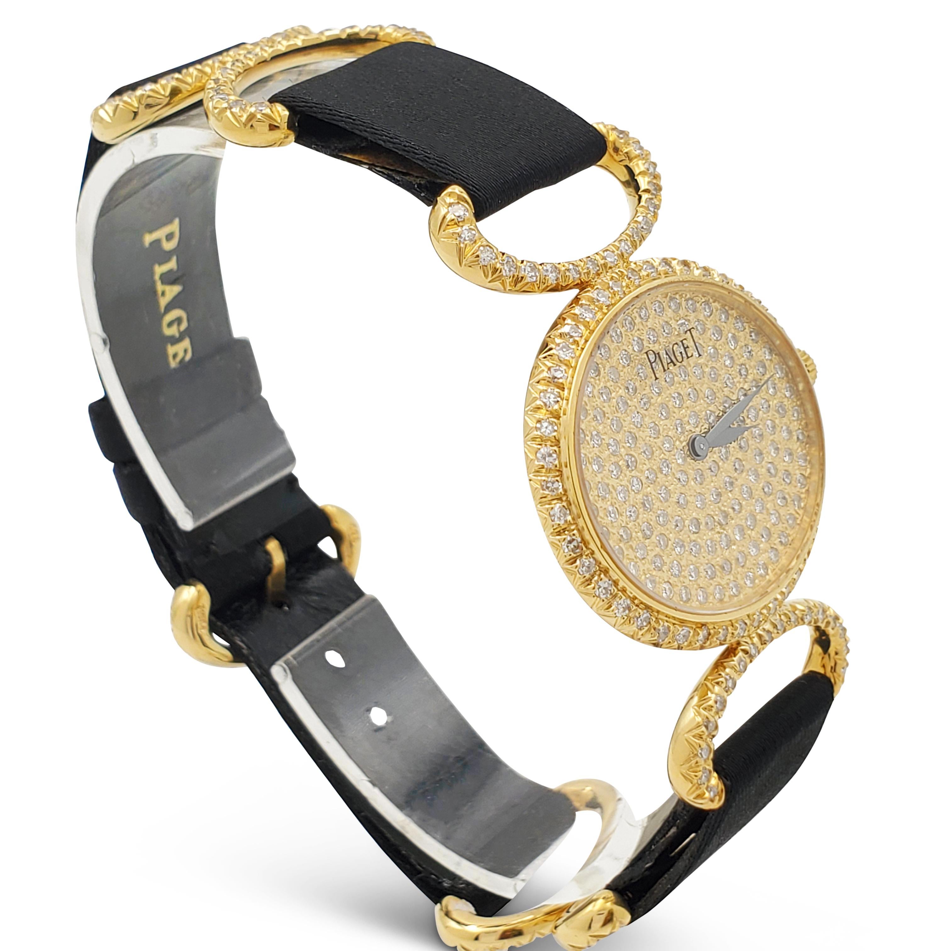 Authentic Piaget ladies watch ref 9802 crafted in 18 karat yellow gold featuring a diamond-set dial, bezel, and strap.  27 mm yellow gold case, mechanical (manual) movement, black nylon and leather strap.  Will fit up to a 6 3/4 inch wrist.  Watch