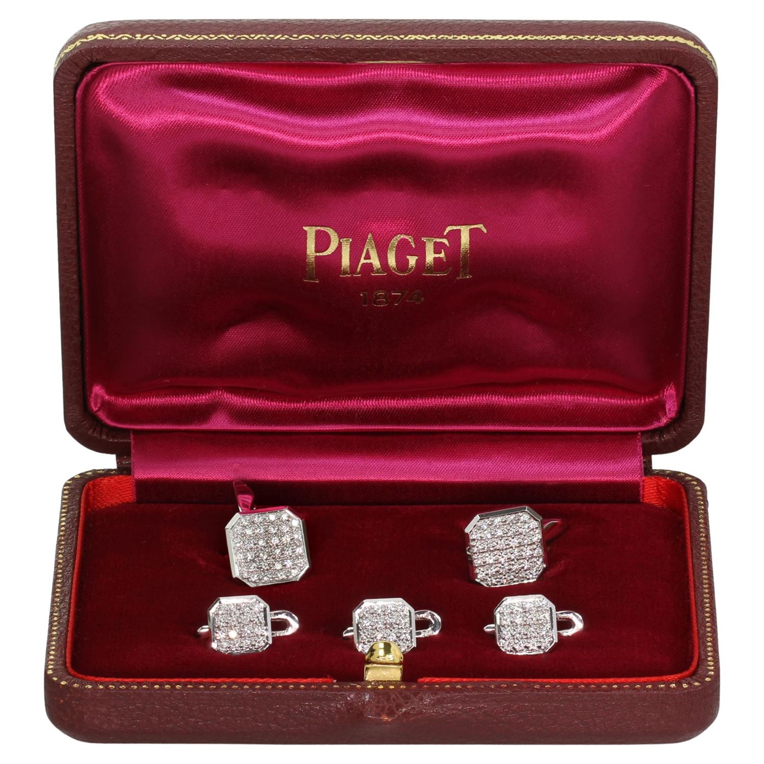 This classic Piaget cufflinks and studs set is crafted in 18k white gold and set with with brilliant-cut round E-F-G VVS2-VS1 diamonds weighing an estimated 2.50 carats. Made in Switzerland circa 2000s. Measurements: 0.51