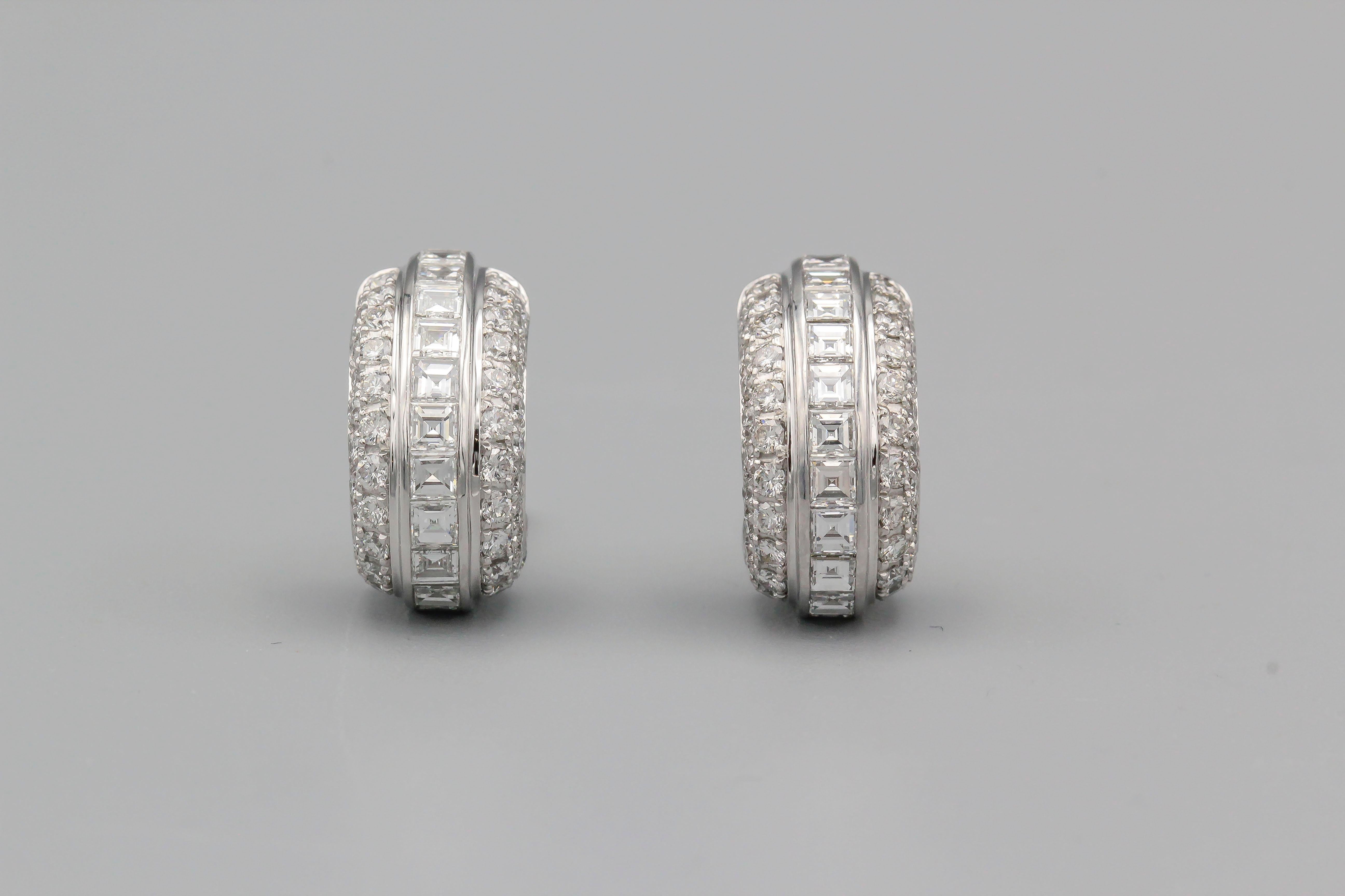 Fine pair of diamond and 18K white gold hoop earrings by Piaget. They feature high grade round and square step cut diamonds of F-G color and VVs clarity, approx. 4 carats total weight.

Hallmarks: 750, Piaget, reference numbers, maker's mark.