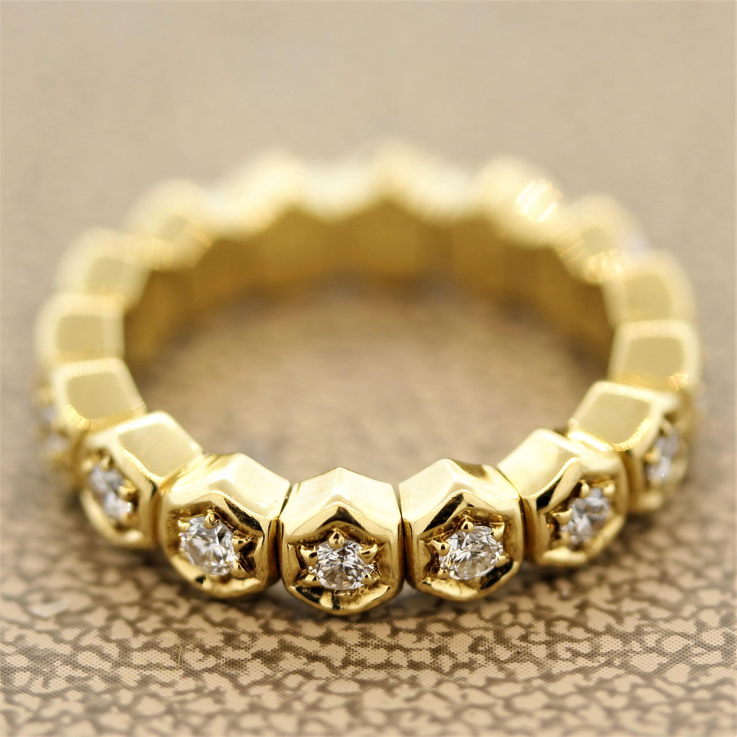 An original ring by Swiss designers Piaget. It features 16 round brilliant cut diamonds weighing a total of 0.48 carats. Each diamond is set in a hexagonal sculpted gold setting. Made in 18k yellow gold, circa 1996.

Ring Size 5
