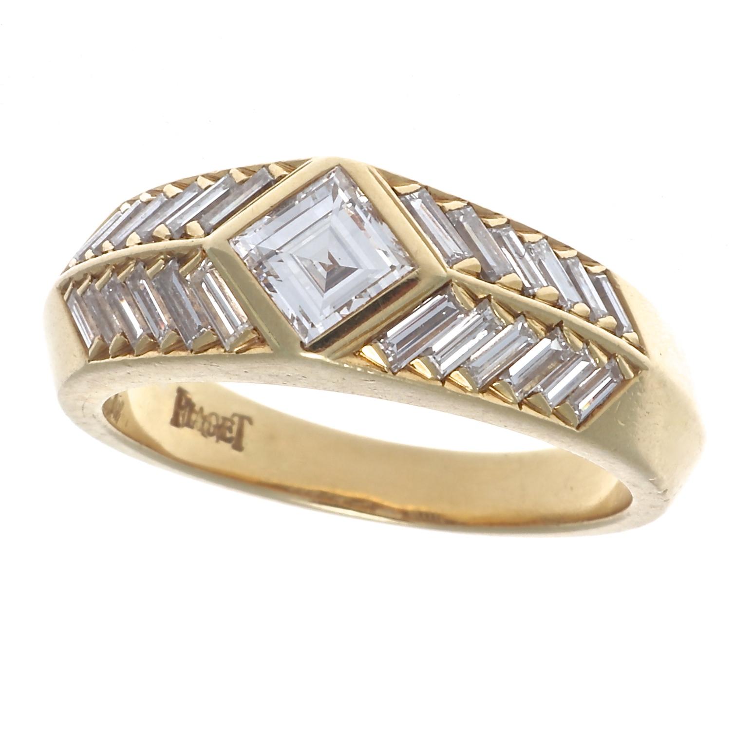 A rich history of futuristic designs has kept Piaget interesting and relevant . Featuring a single sideways set emerald cut diamond abstractly accented by pyramids of numerous baguette cut diamonds. Crafted in 18k yellow gold. Signed Piaget. Ring