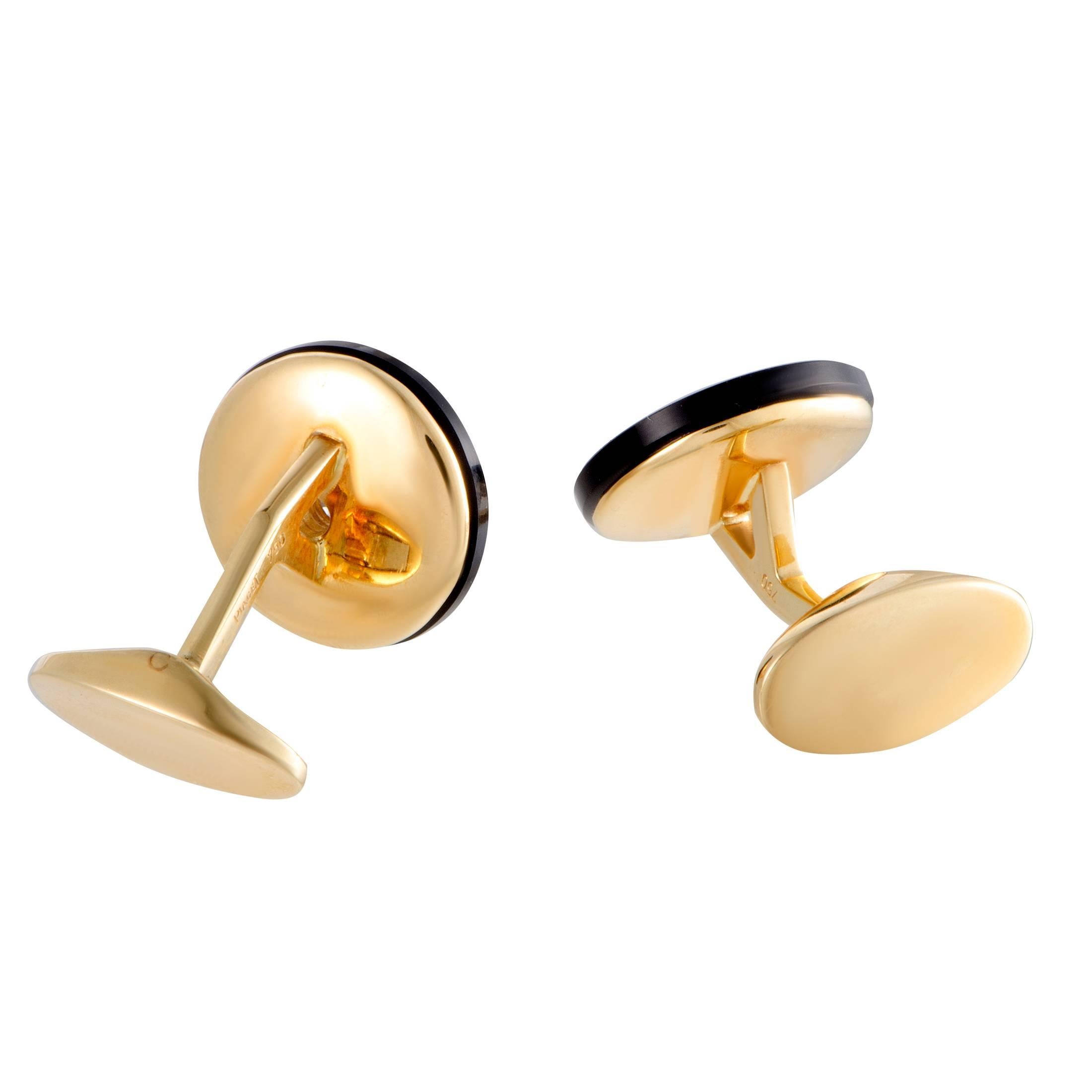 These vintage cufflinks by Piaget are chicly designed in glistening 18K yellow gold. The stunning pair of cufflinks feature 0.60ct of sparkling diamonds and glamorous onyx stones in its classy design that gives it an elegantly charming appeal.
