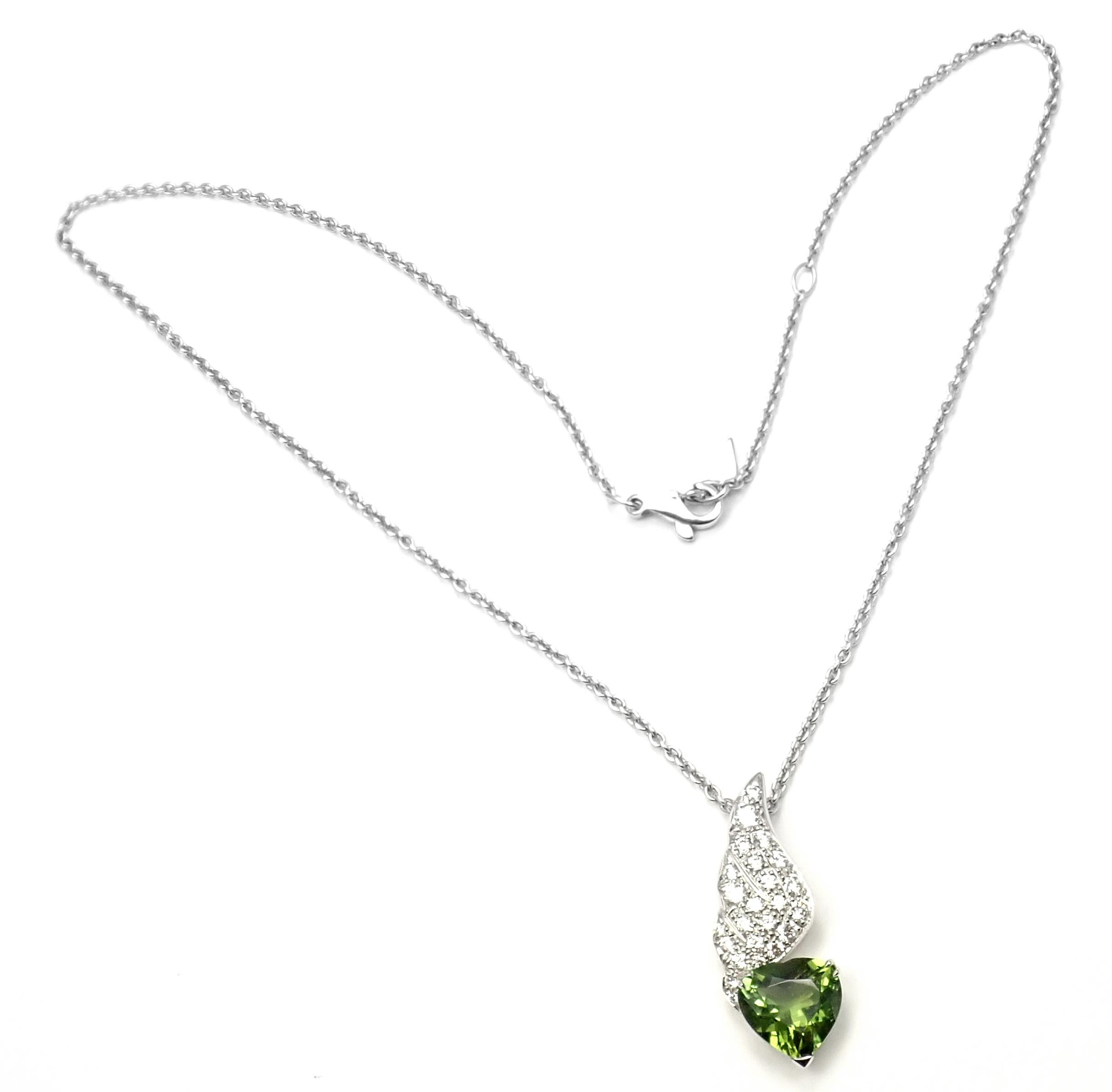 18k White Gold Diamond And Peridot Heart Pendant Necklace by Piaget. 
With round brilliant cut diamonds VS1 clarity, G color total weight approximately .90ct
1 heart shape peridot.
Retail Price: $12,500 plus tax.
Details: 
Length: 17