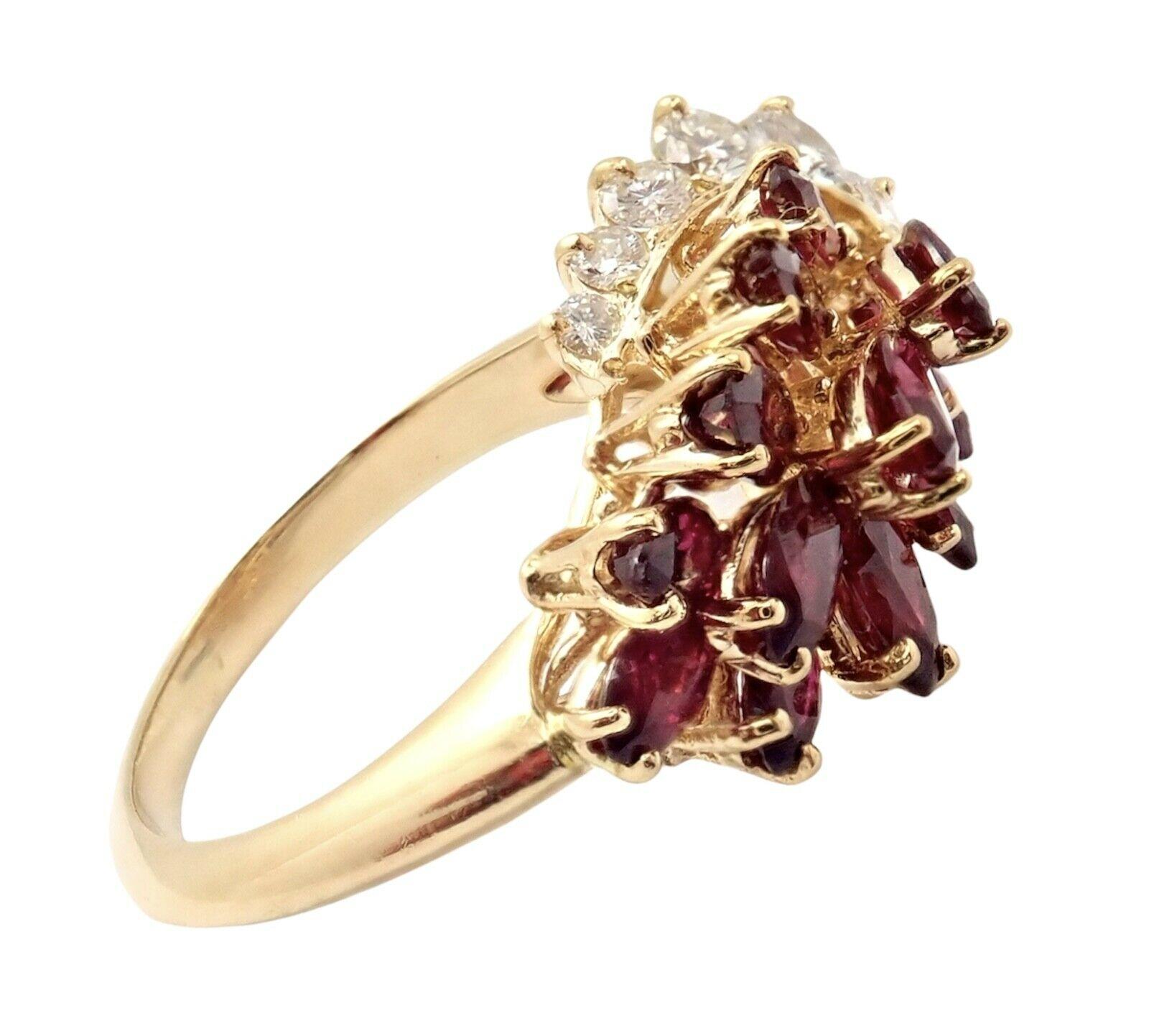 18k Yellow Gold Diamond And Ruby Cocktail Ring by Piaget. 
With 11 brilliant round diamonds VS1 clarity, G color total weight approximtely 0.70ct
12 marquise rubies 1.50ctw
Details: 
Weight: 6 grams
Width: 8mm
Ring Size: 6.5
Stamped Hallmarks: